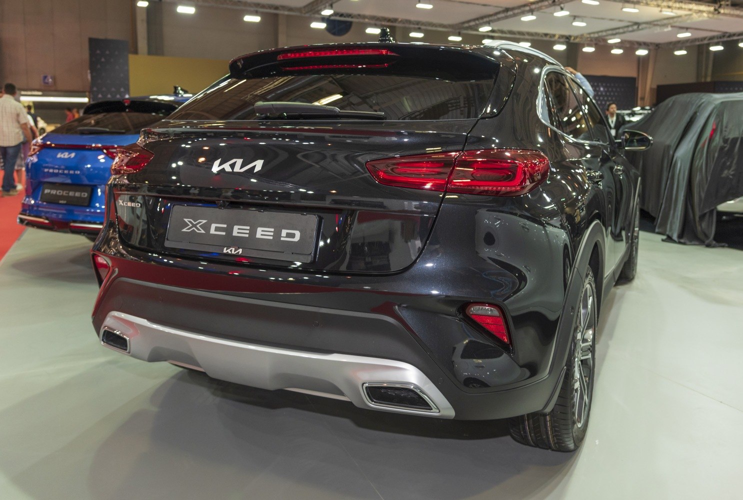 Rear view of vehicle with LED tail lights and dual exhaust pipes.