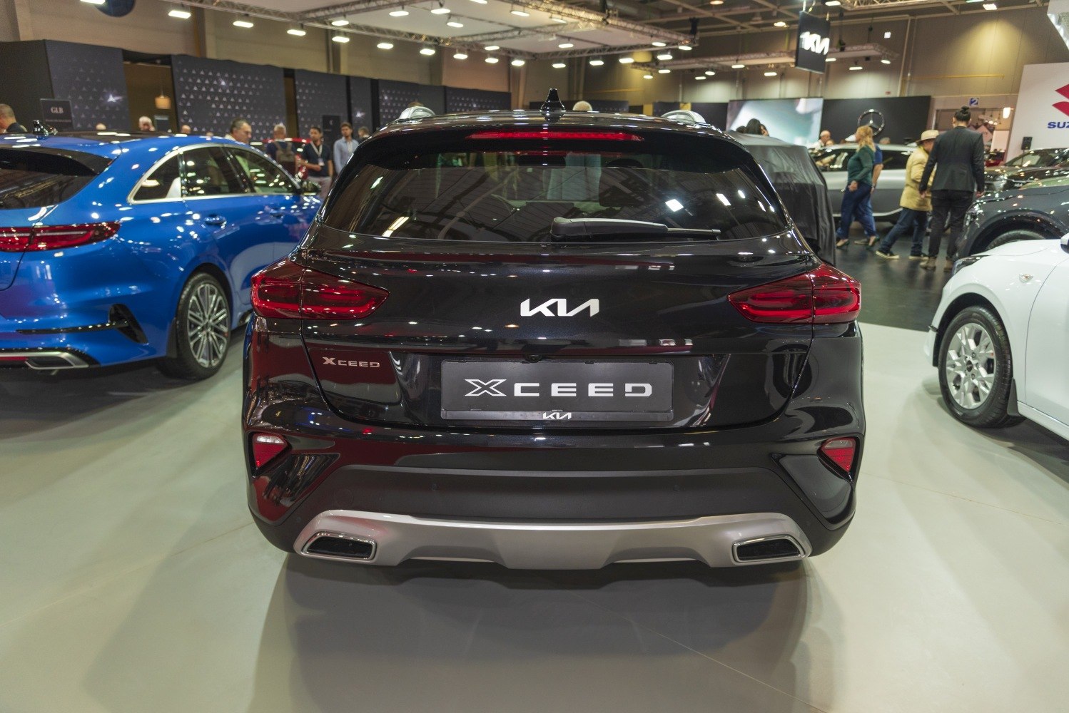 Rear view with distinctive tail lights and dual exhaust outlets