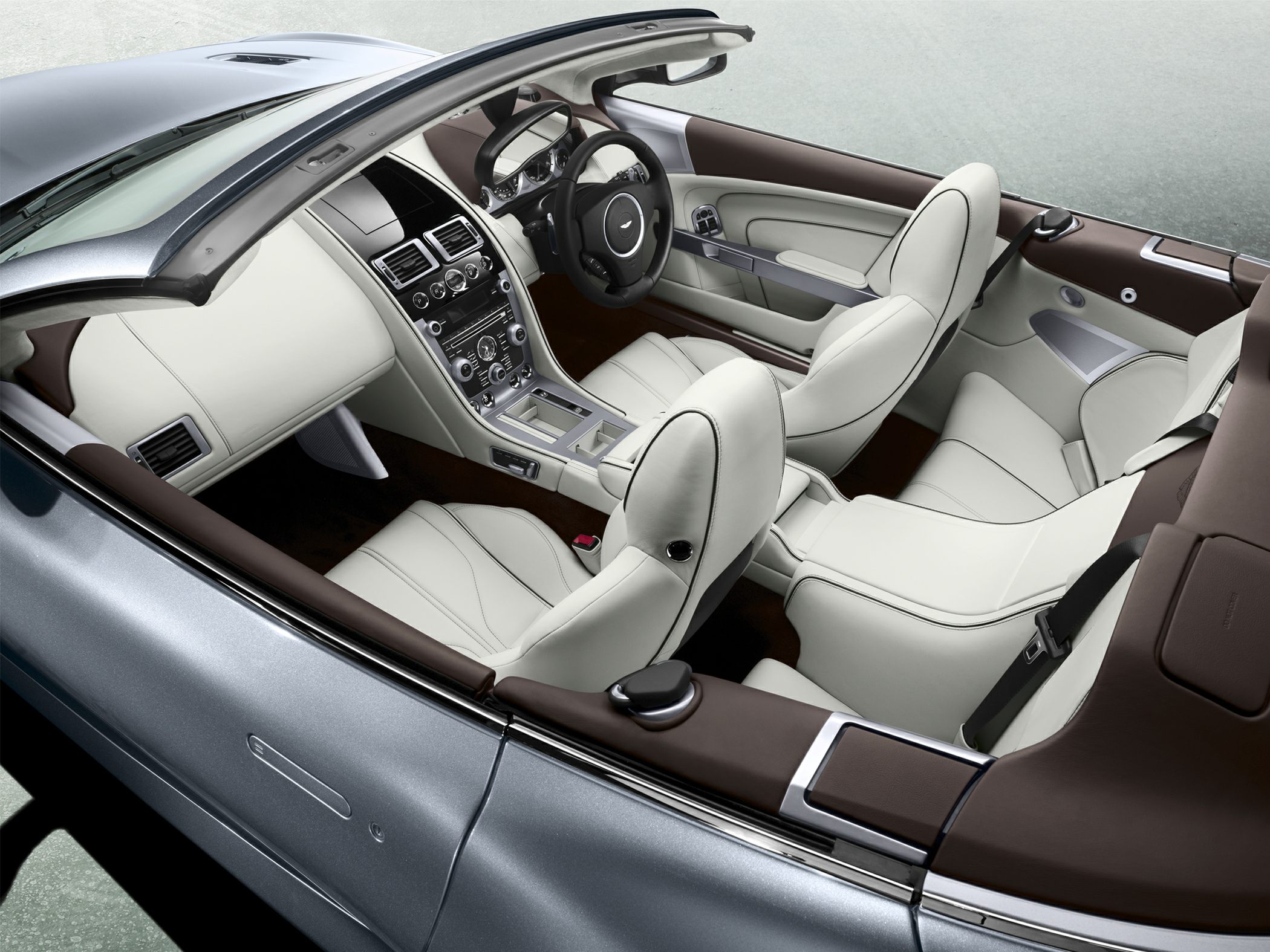 Luxury convertible interior with leather seats and advanced dashboard controls