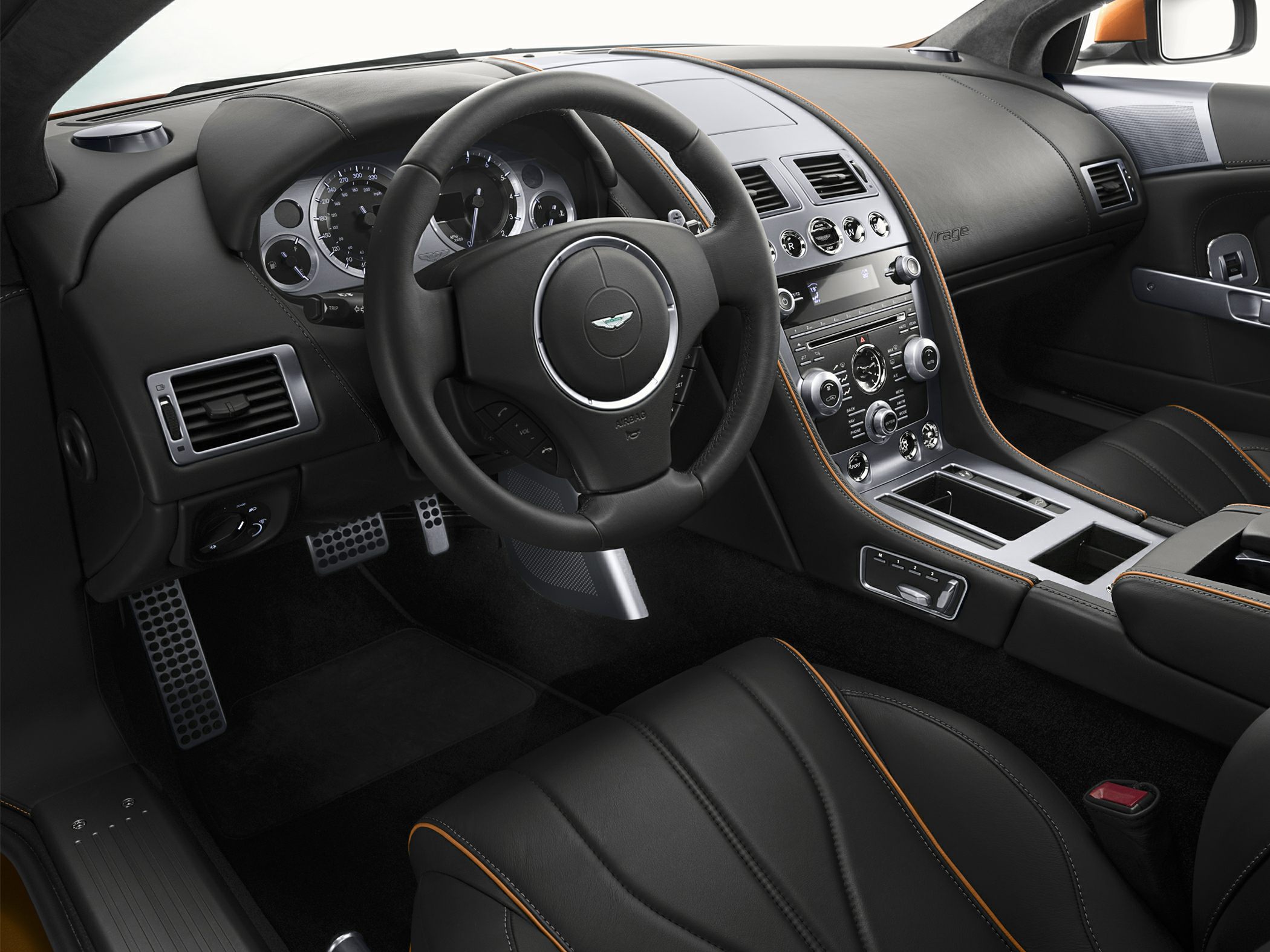 Black leather interior with orange stitching and modern dashboard controls