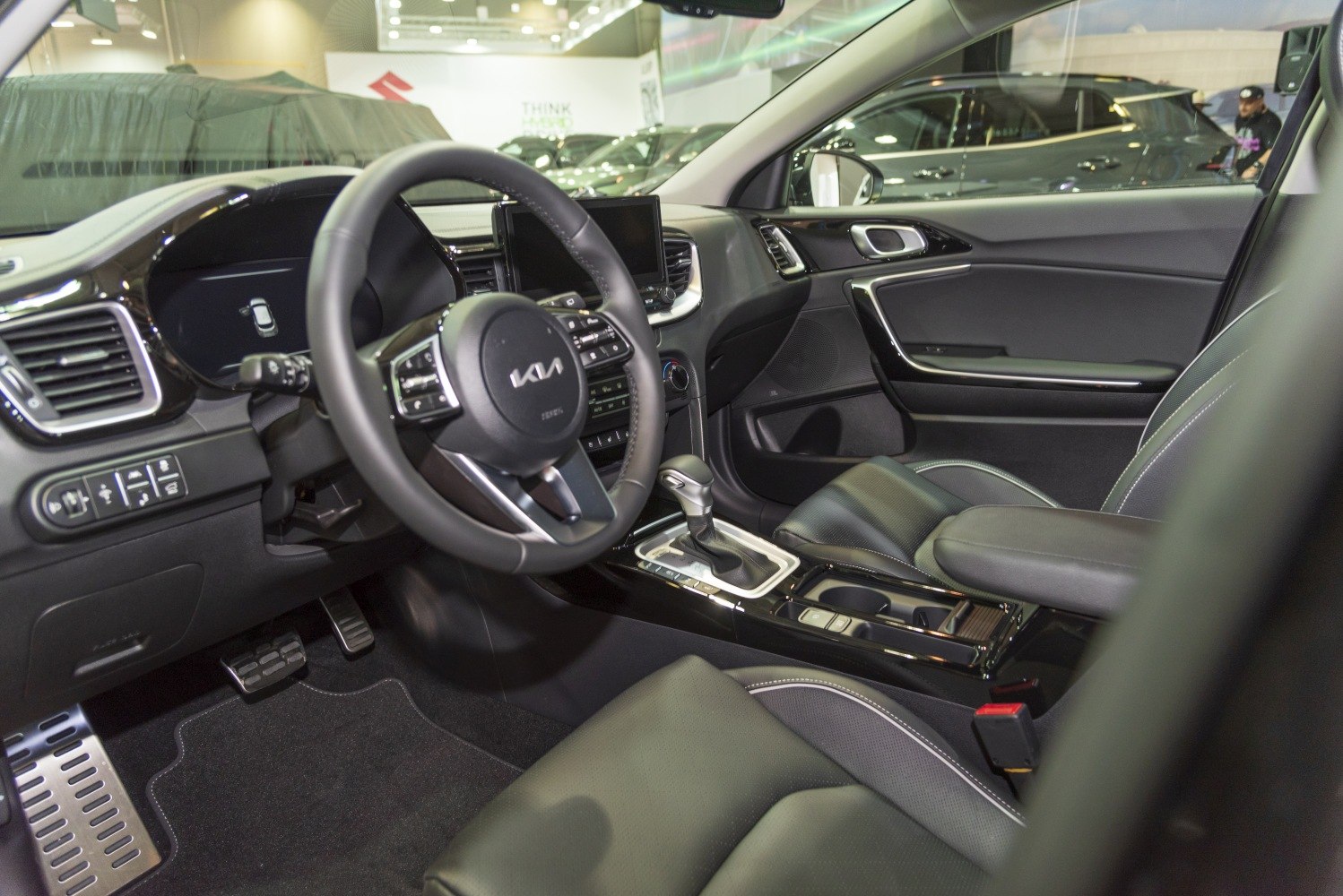 Modern steering wheel, digital dashboard, center console with gear selector