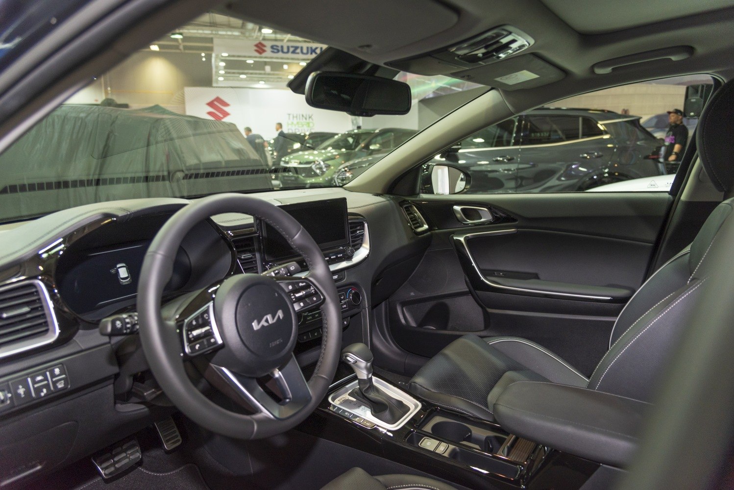 Car interior dashboard, steering wheel, center console with gear shifter