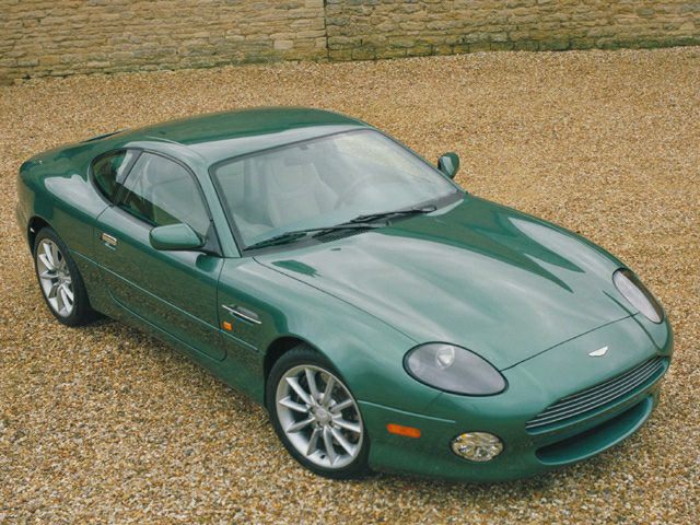 Green sports coupe with sleek aerodynamic design and distinctive front headlights