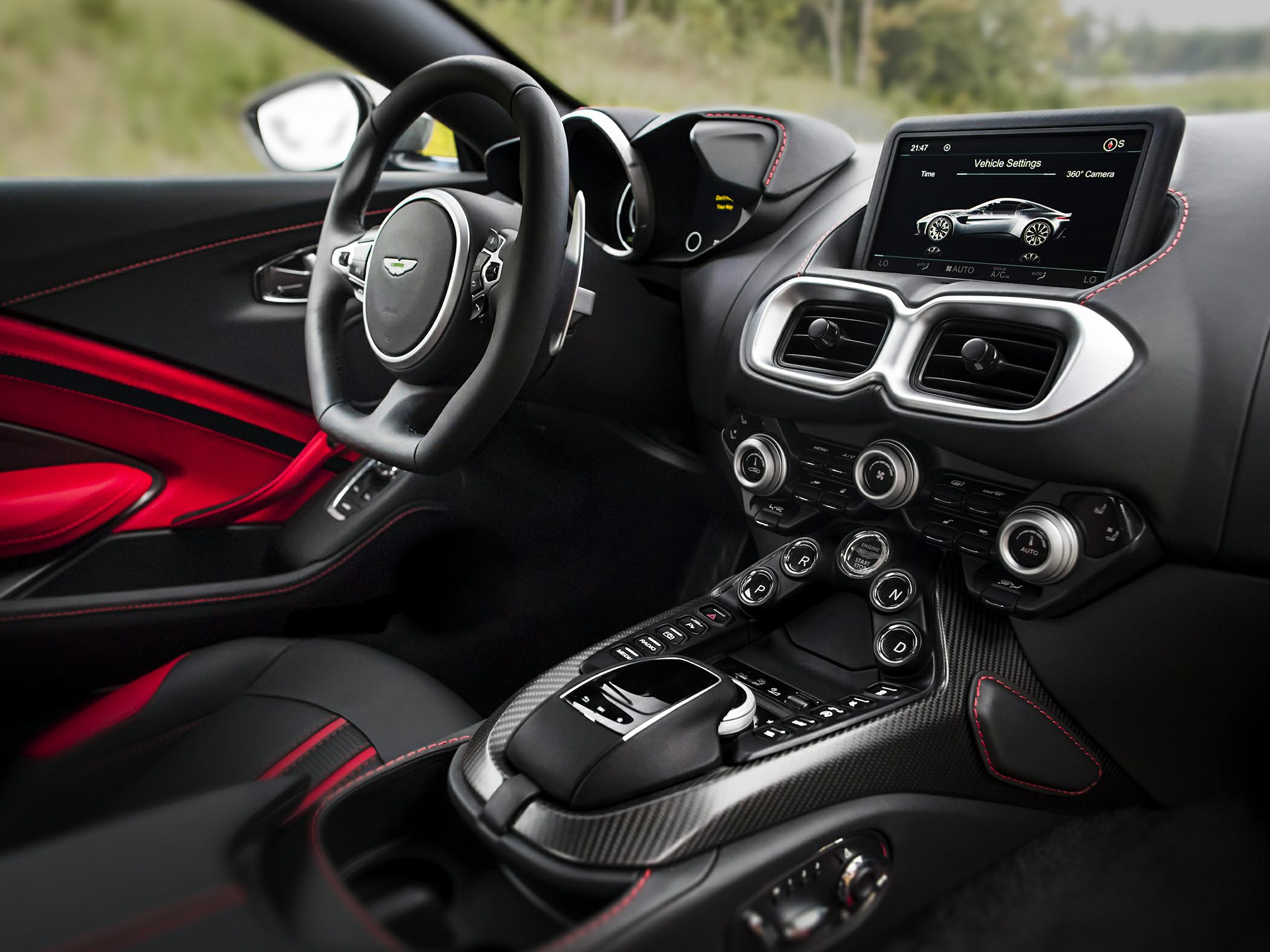 Luxury interior with carbon fiber center console and digital touchscreen display