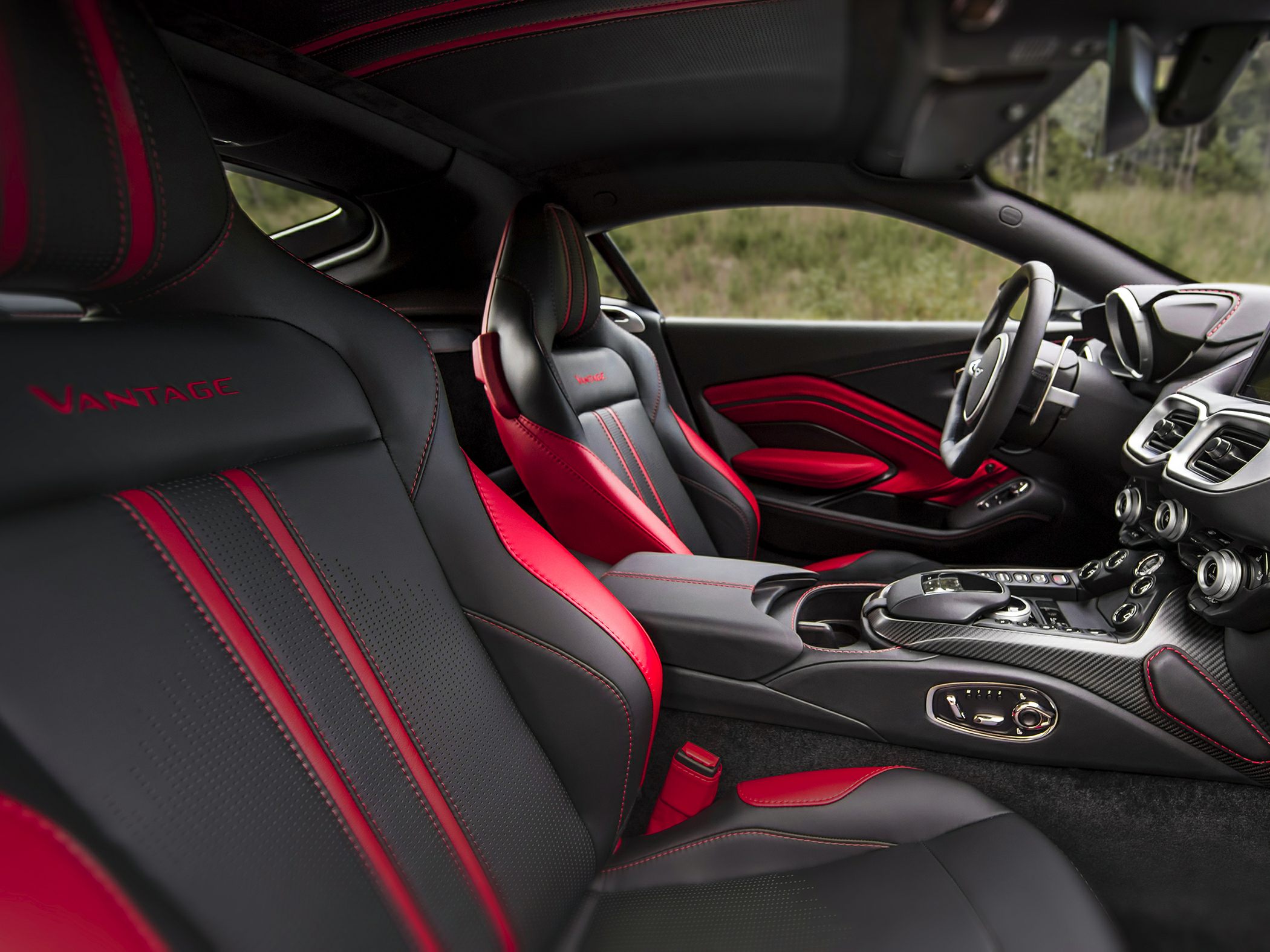 Red and black leather sport seats with carbon fiber center console interior