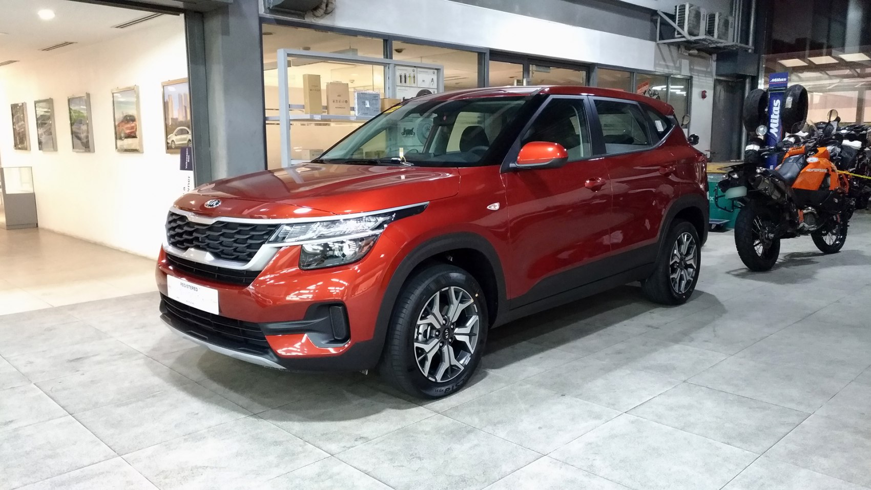 Red compact SUV with alloy wheels and LED headlights