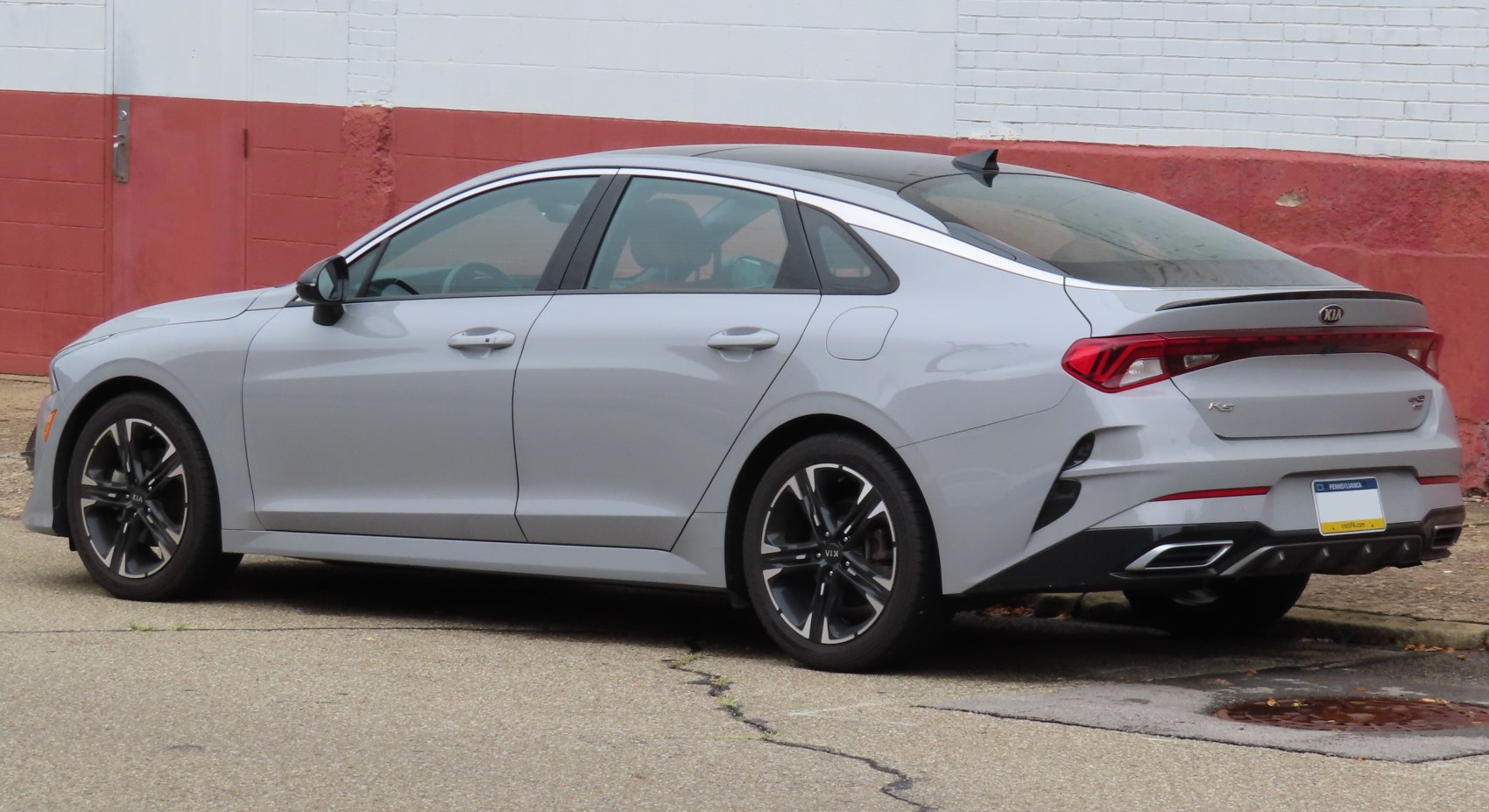 Rear angled view highlighting tail light bar and alloy wheels