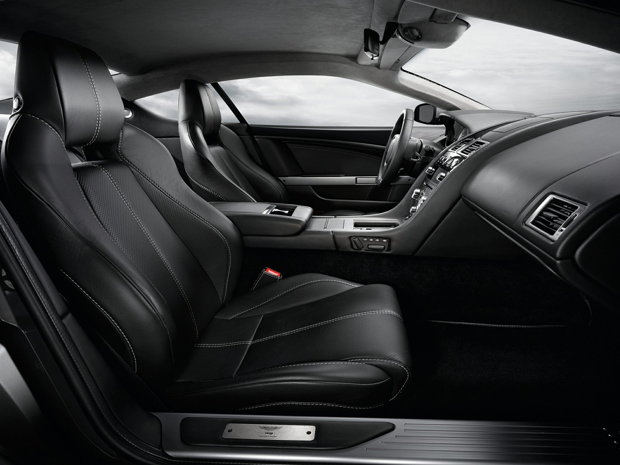 Black leather sport seats with detailed stitching and luxury dashboard