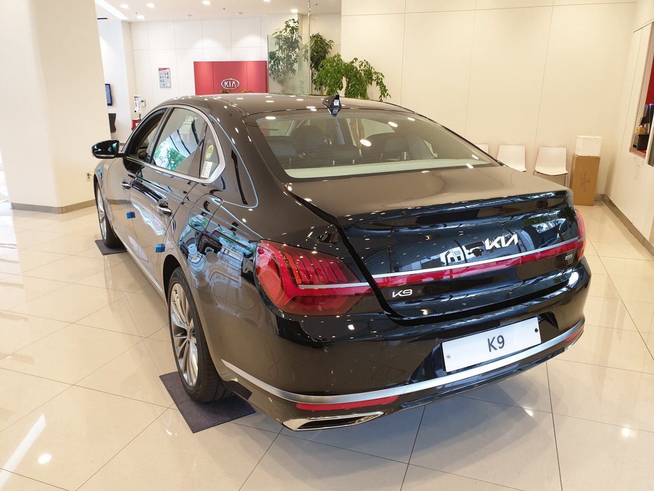 rear and side view of a luxury sedan in showroom