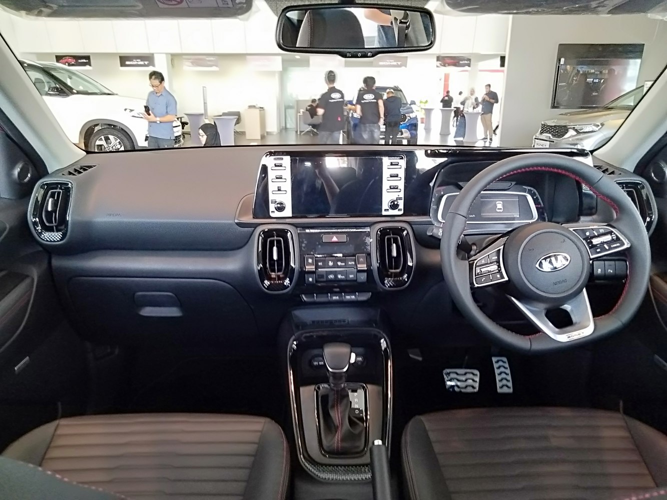 Modern car interior with touchscreen dashboard and multifunction steering wheel