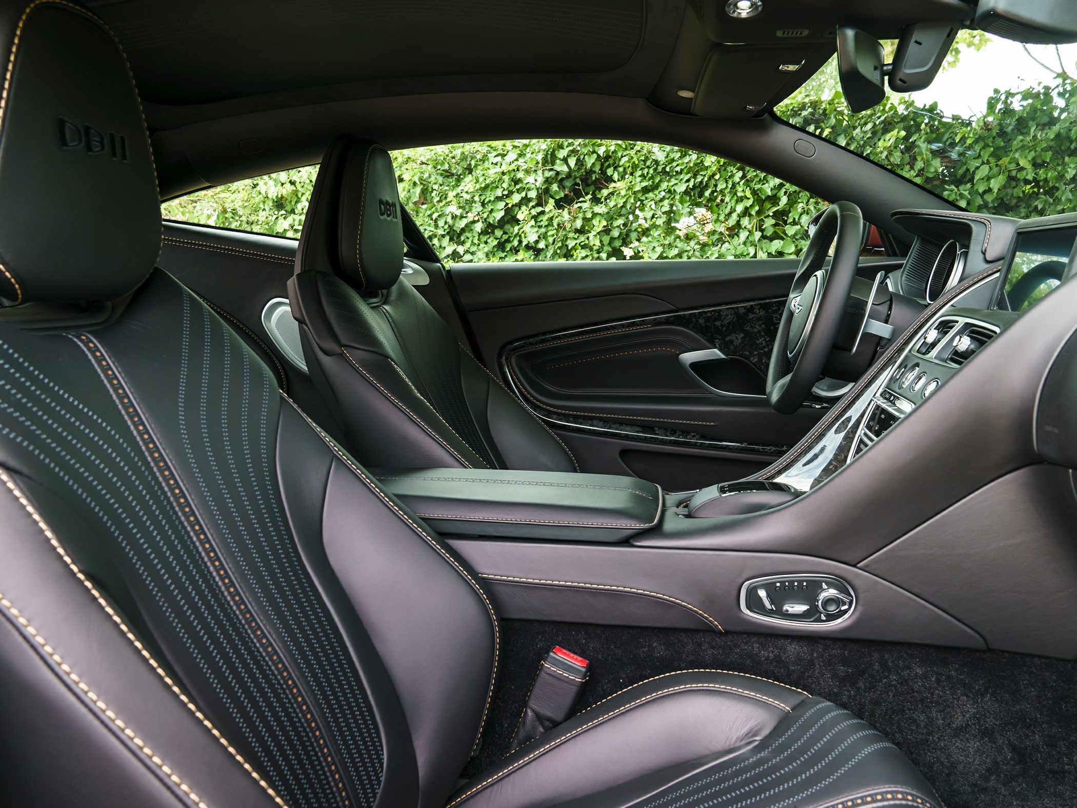 Luxurious black leather interior with detailed stitching and advanced controls