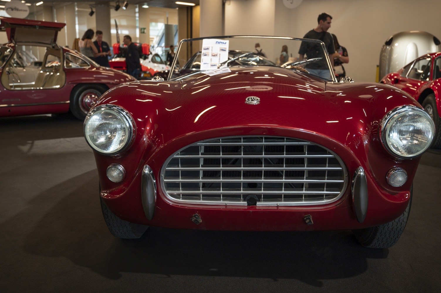 Vintage convertible sports car front grille and round headlights