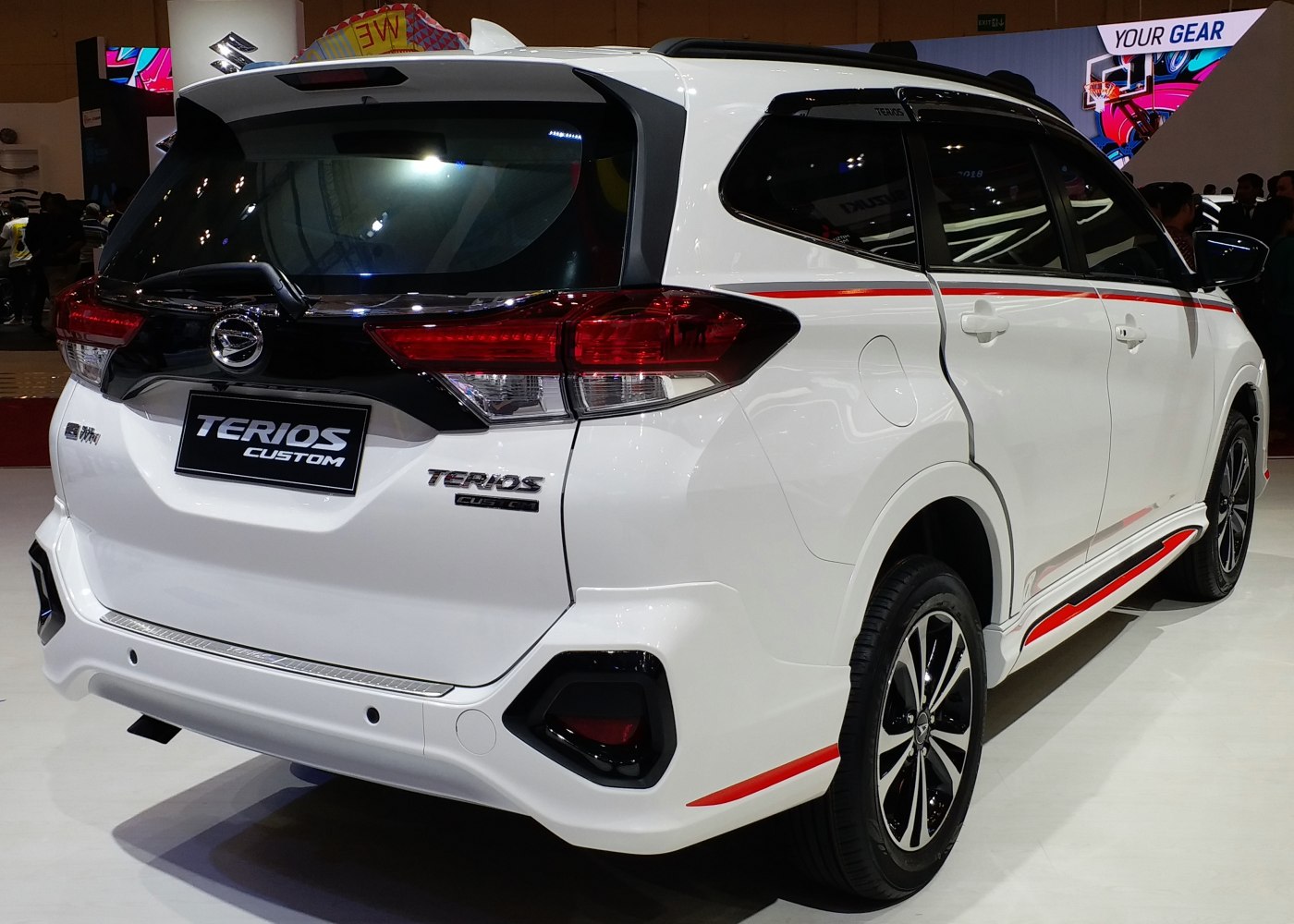 Rear and side view of SUV with custom red accents and modern tail lights