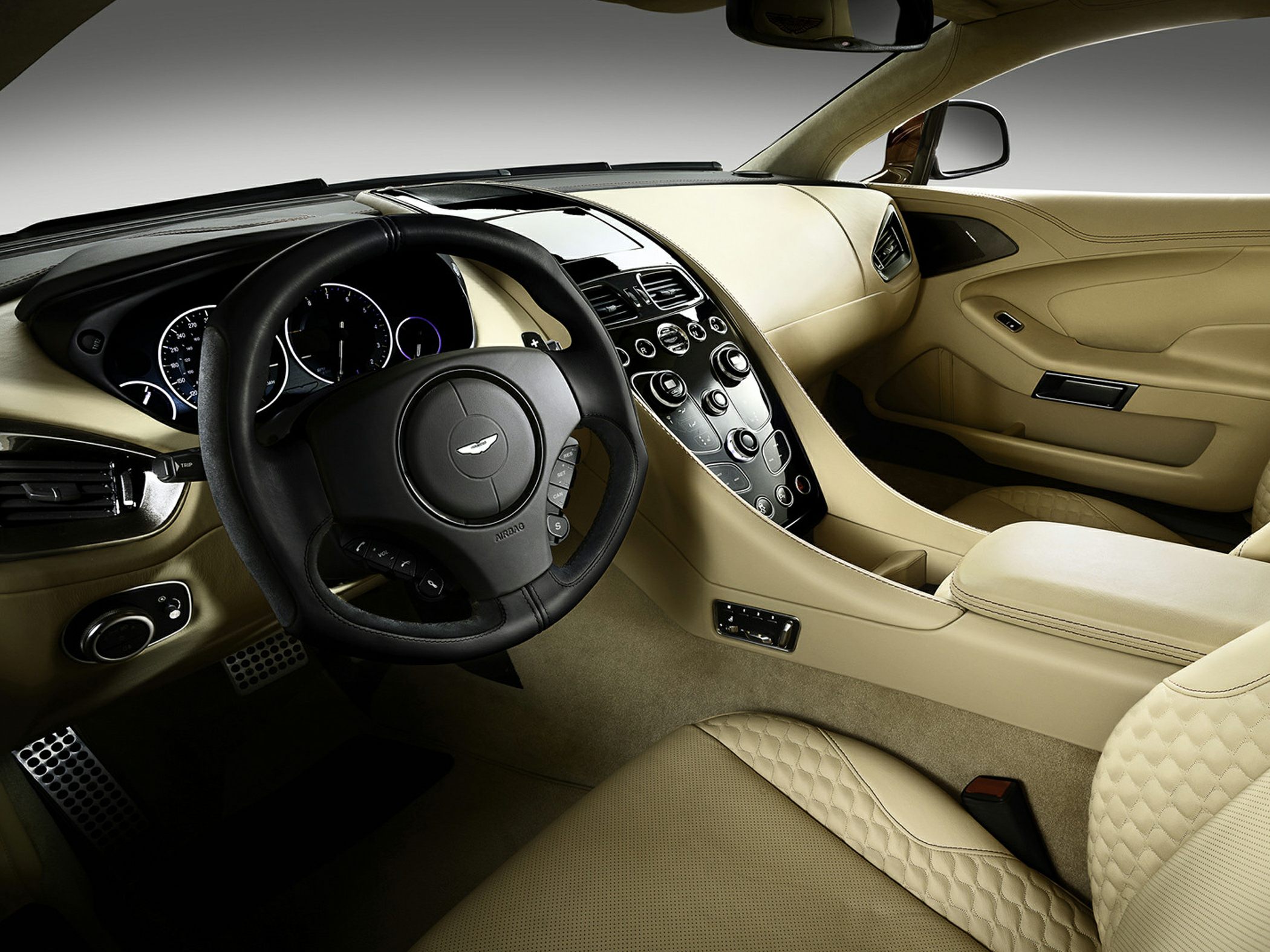 Beige leather interior with quilted seats and modern dashboard