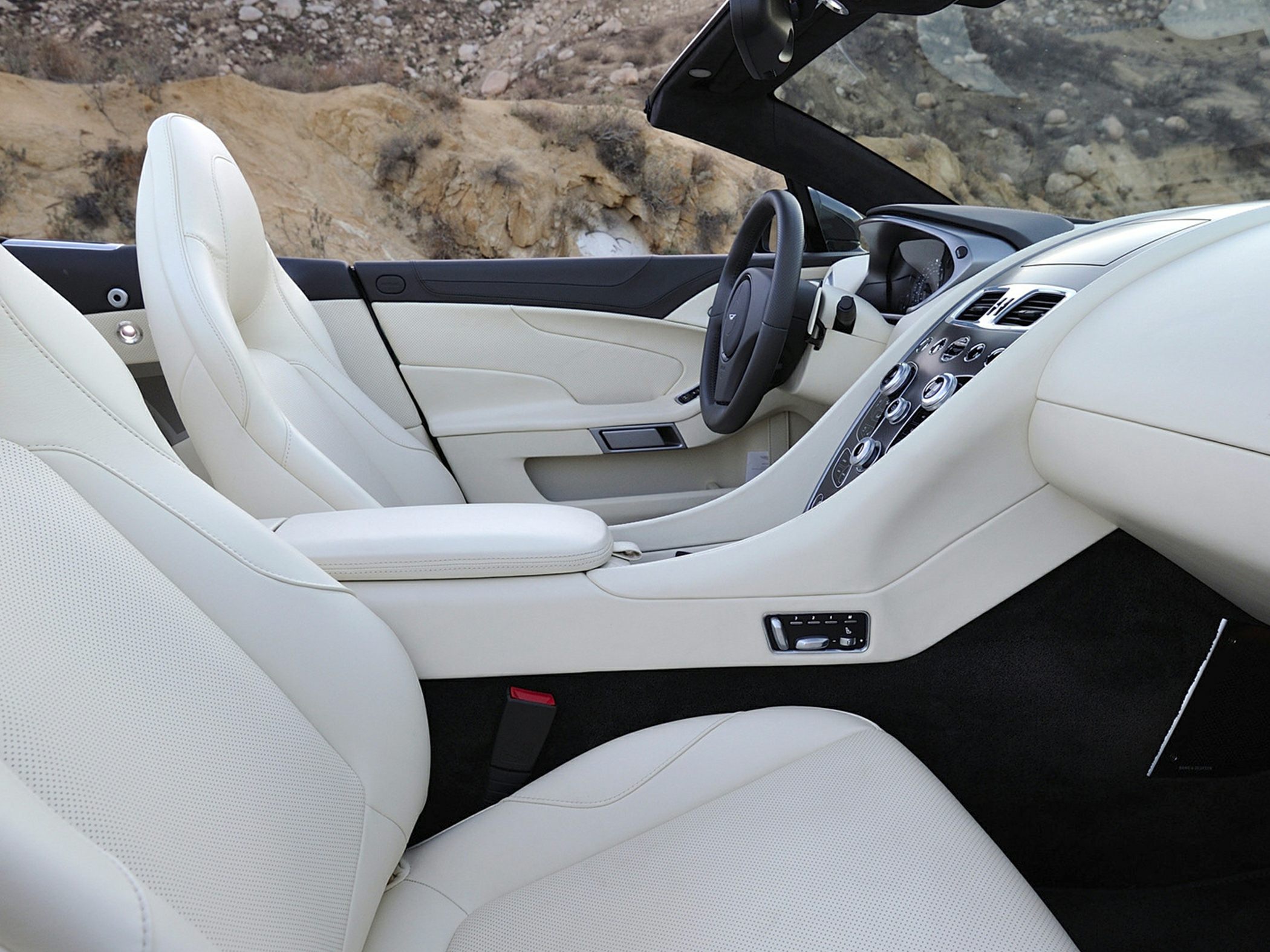 White leather seats and modern dashboard in convertible interior
