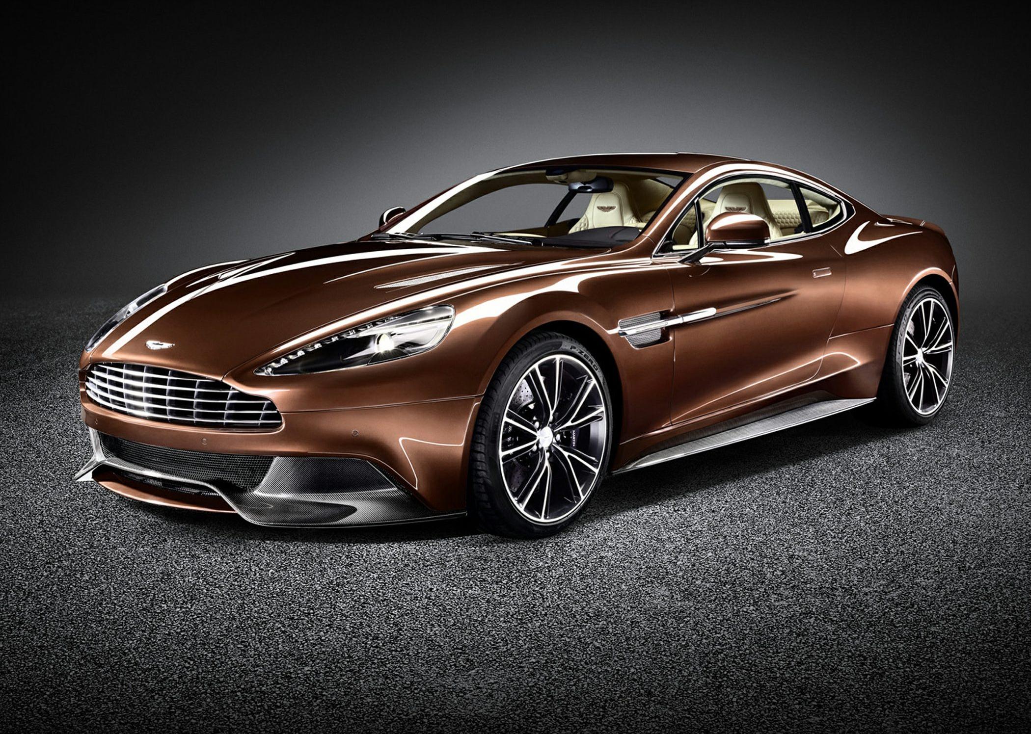 Front three-quarter view of a sleek luxury coupe with distinct headlights and alloy wheels