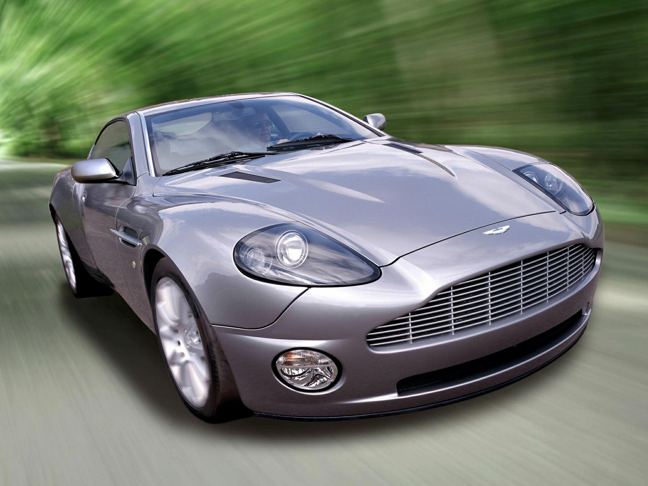 Front angled view of sleek silver sports car with prominent grille