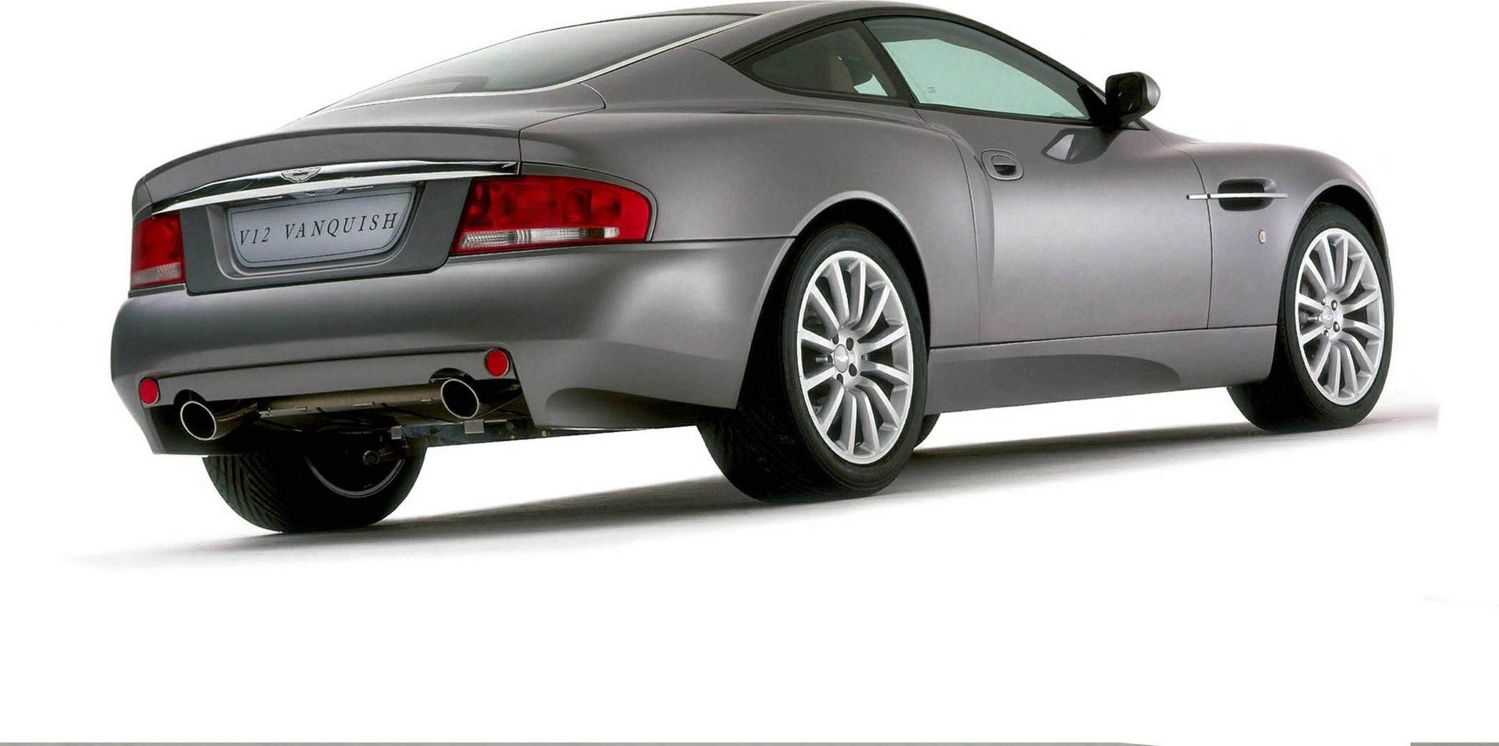 Rear and side profile of a V12 coupe with dual exhaust and alloy wheels