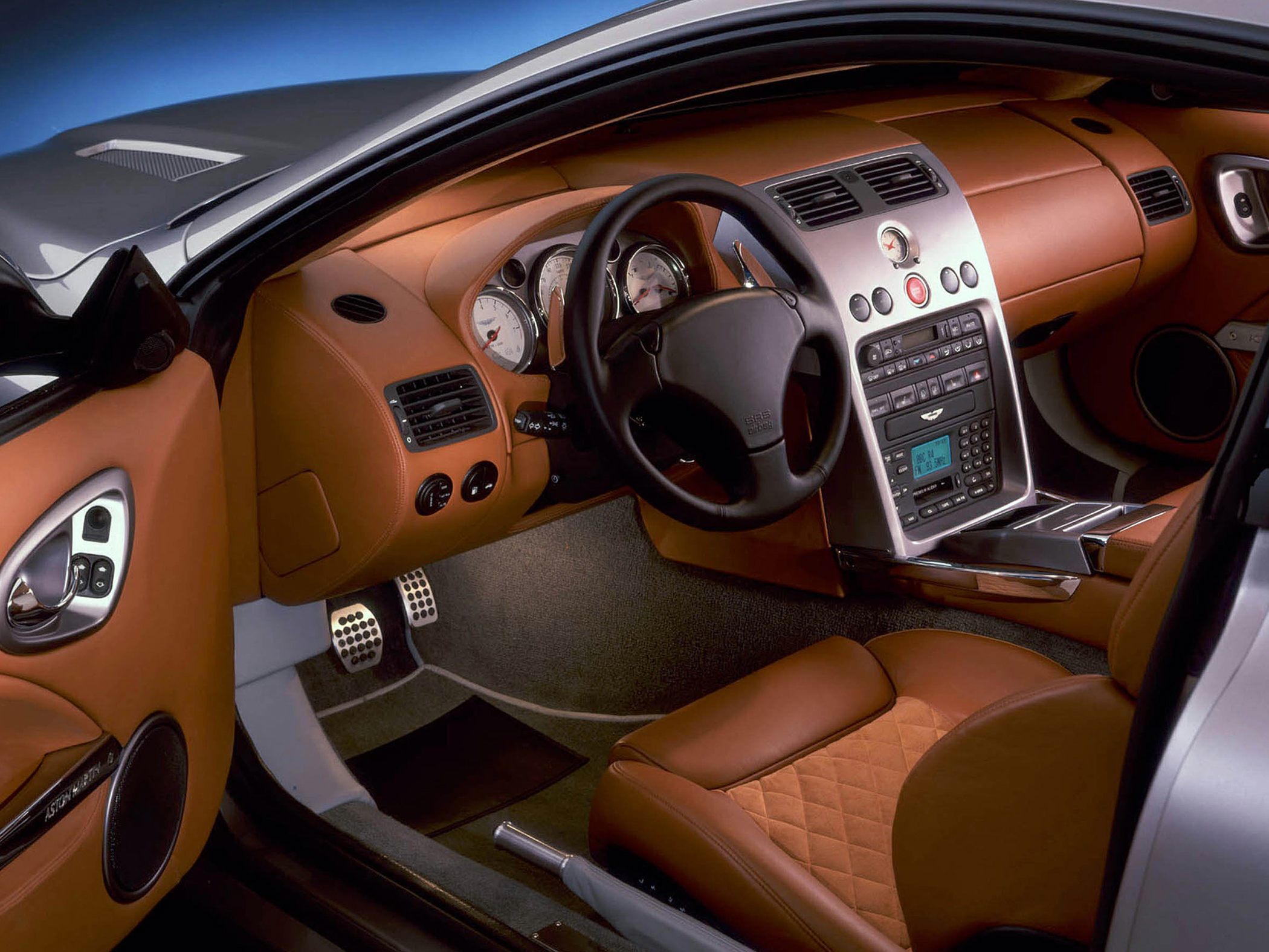 Luxury brown leather car interior with dashboard and steering wheel