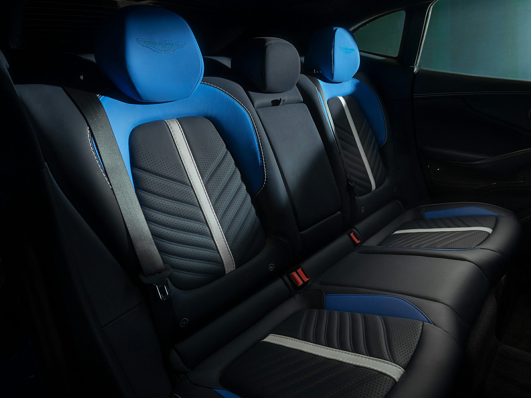 Rear seats with blue leather upholstery and headrests
