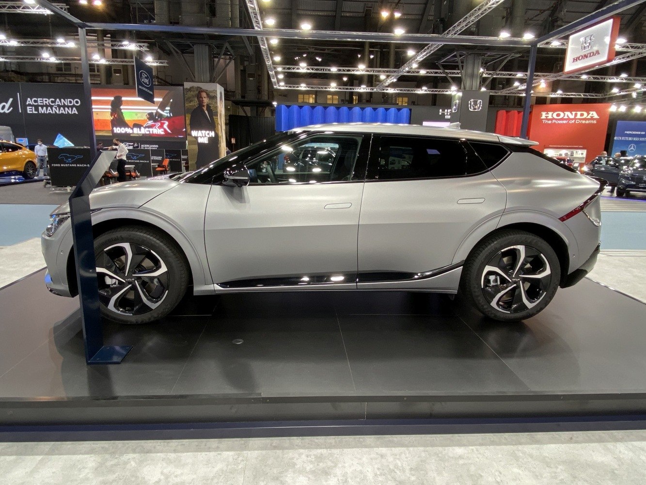 Silver electric crossover with aerodynamic design and futuristic alloy wheels