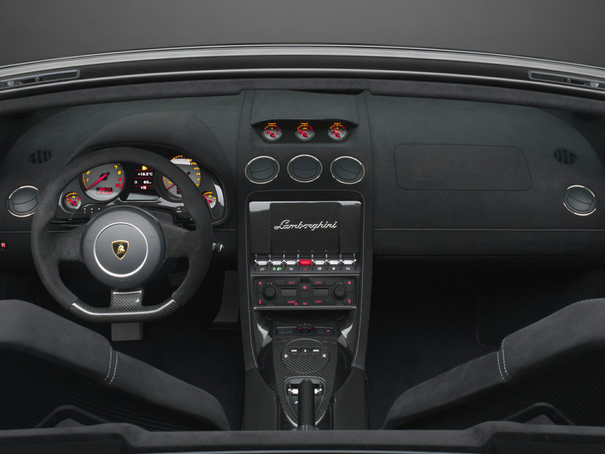 Luxury sports car interior with carbon fiber dashboard and detailed instrumentation