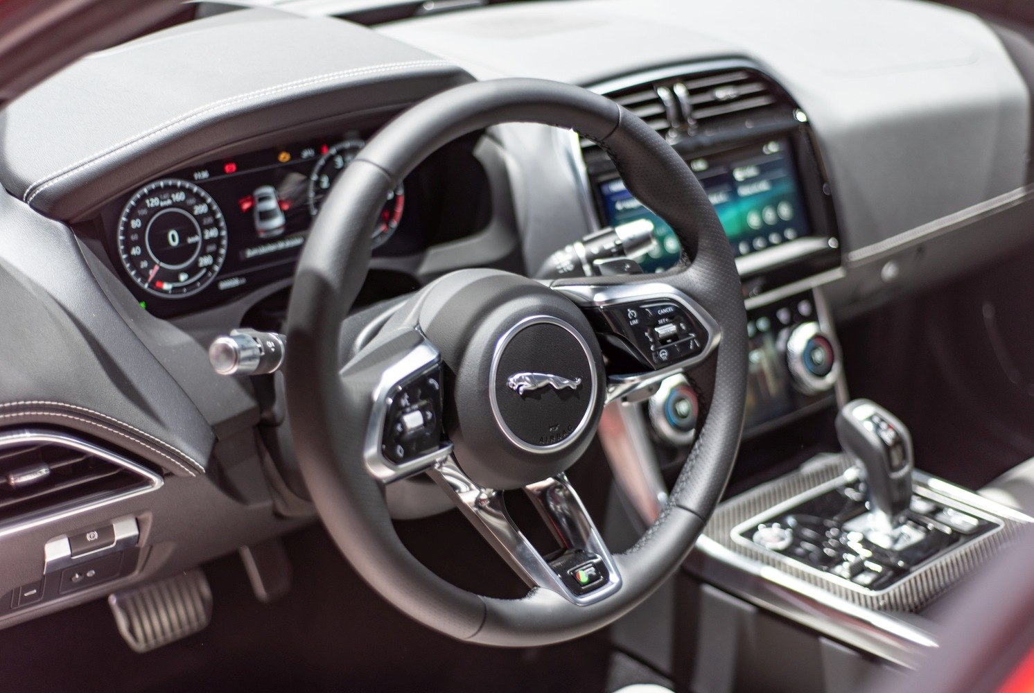 Leather steering wheel with digital dashboard and center console