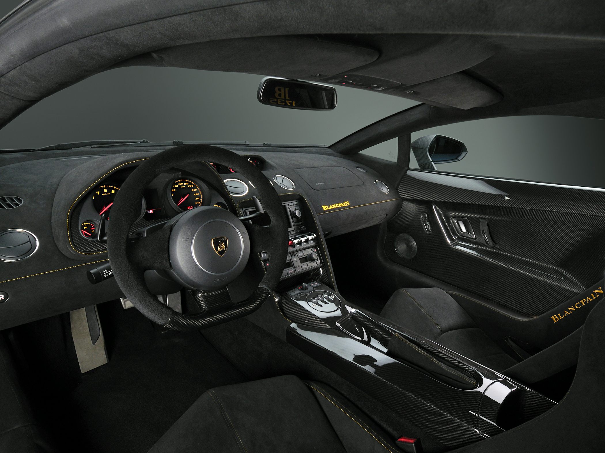 Carbon fiber interior with Alcantara steering wheel and Blancpain branding