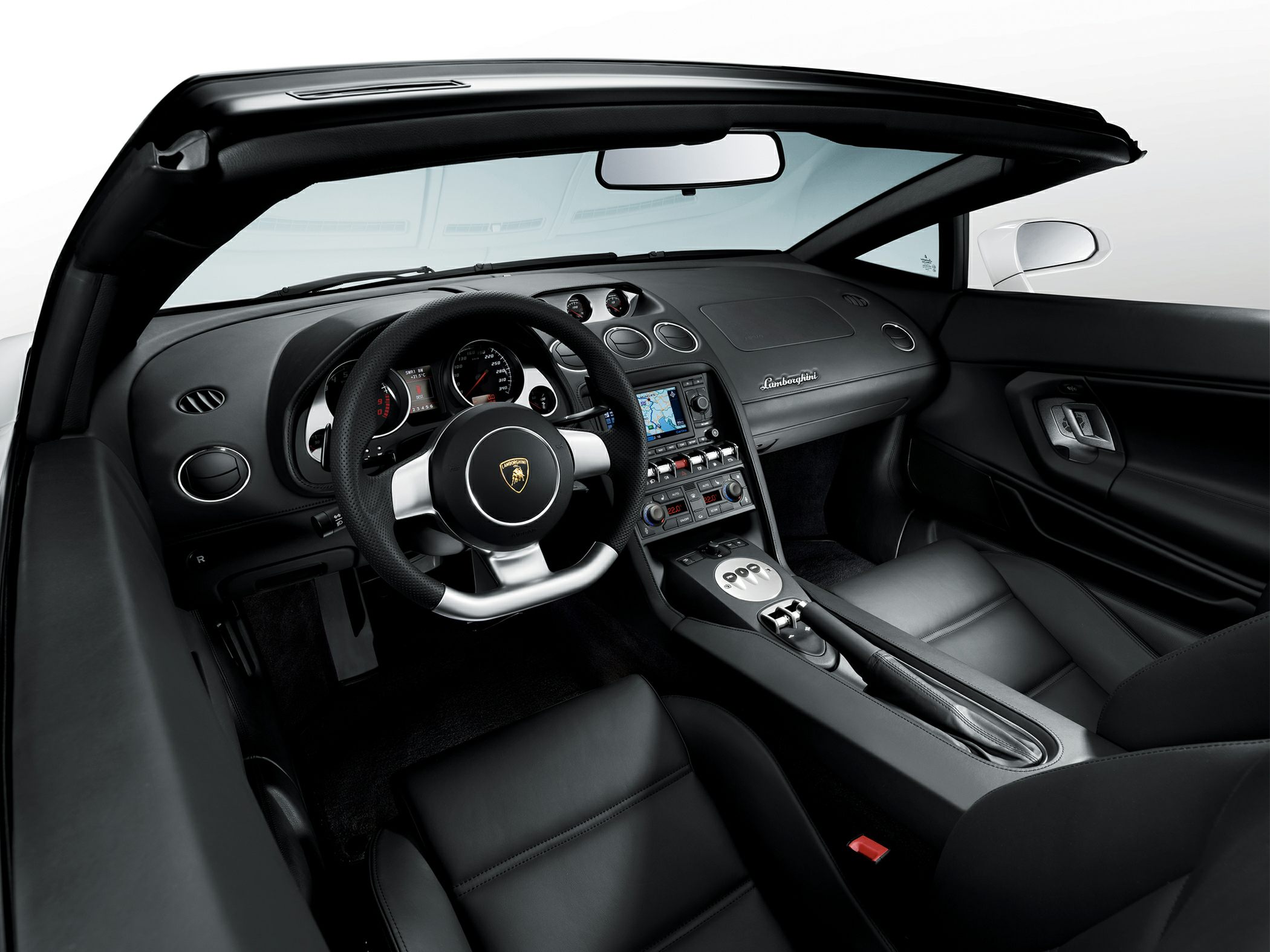 Convertible luxury sports car interior with detailed dashboard and steering wheel