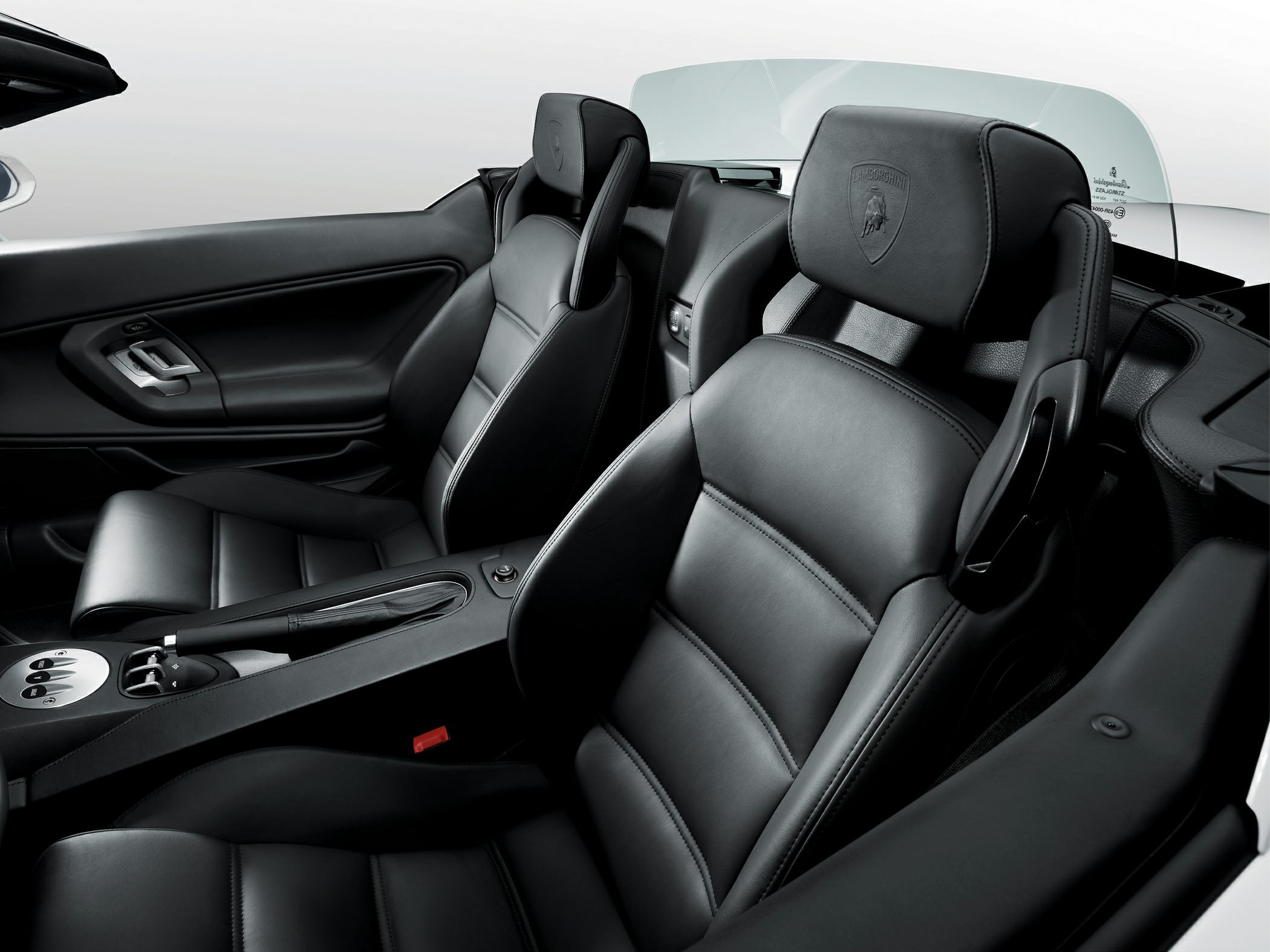 Premium black leather sports seats with detailed stitching in luxury convertible.