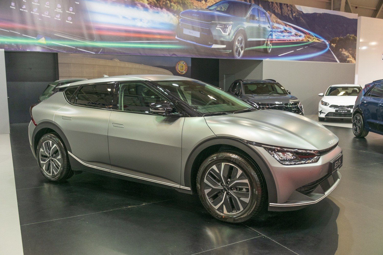 Sleek aerodynamic electric crossover with distinctive LED headlights and alloy wheels