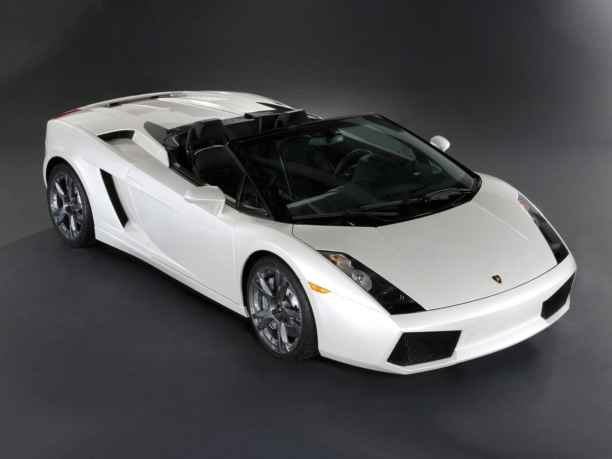 White convertible sports car with sleek front and open top