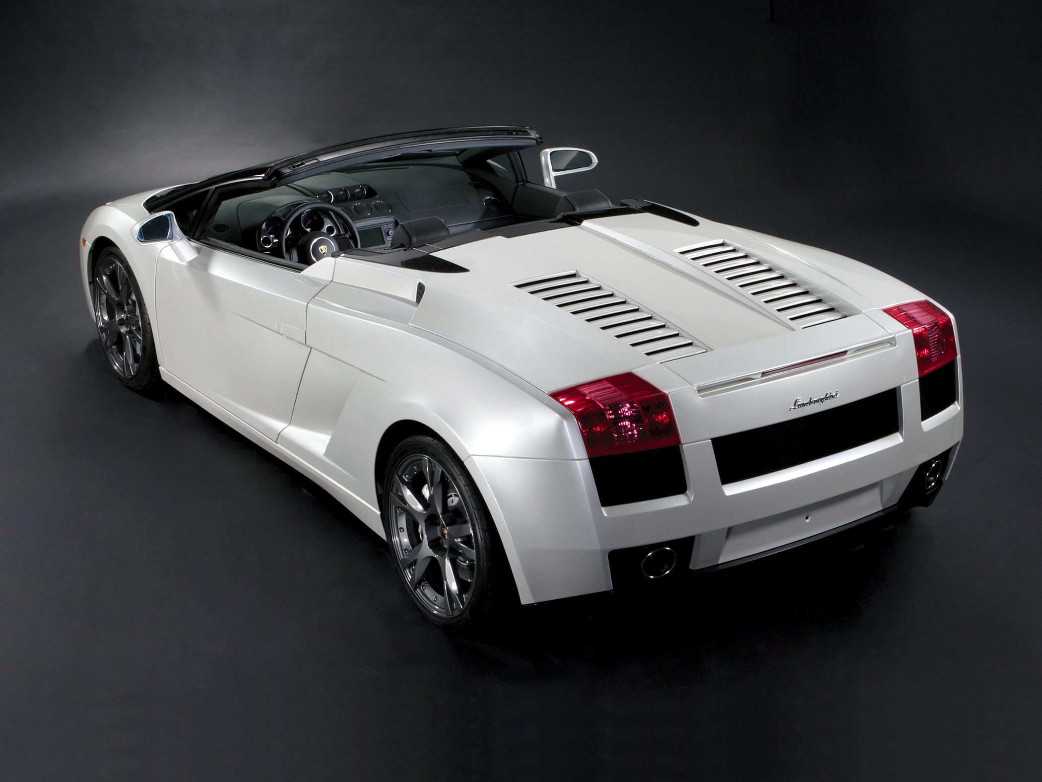 Rear view of convertible with distinctive vents and alloy wheels