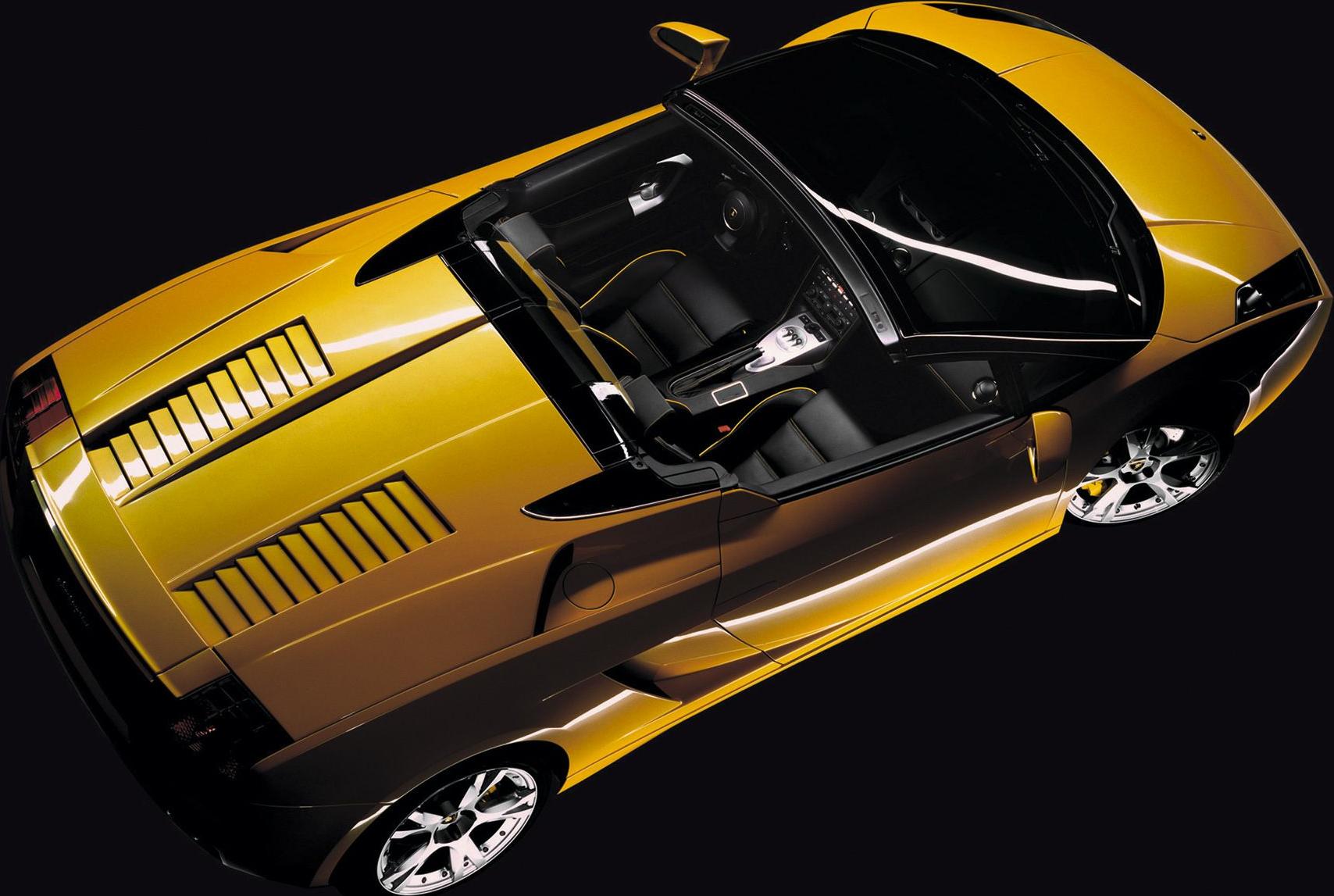 Open-top yellow sports car showcasing convertible design and interior