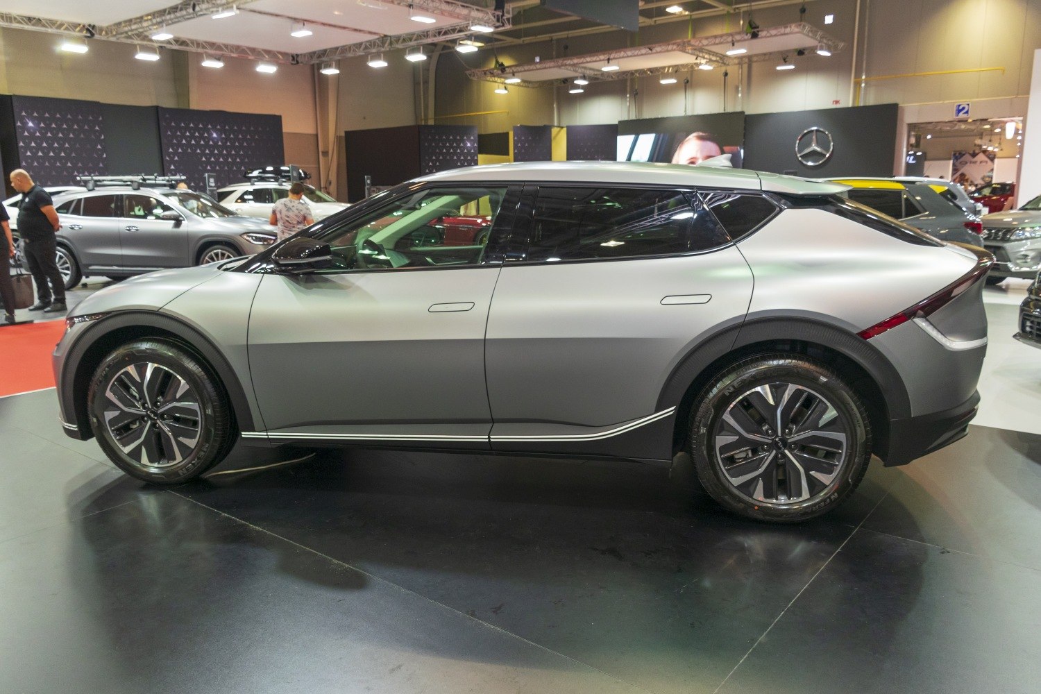 Futuristic electric SUV side view with sleek aerodynamic shape and two-tone finish