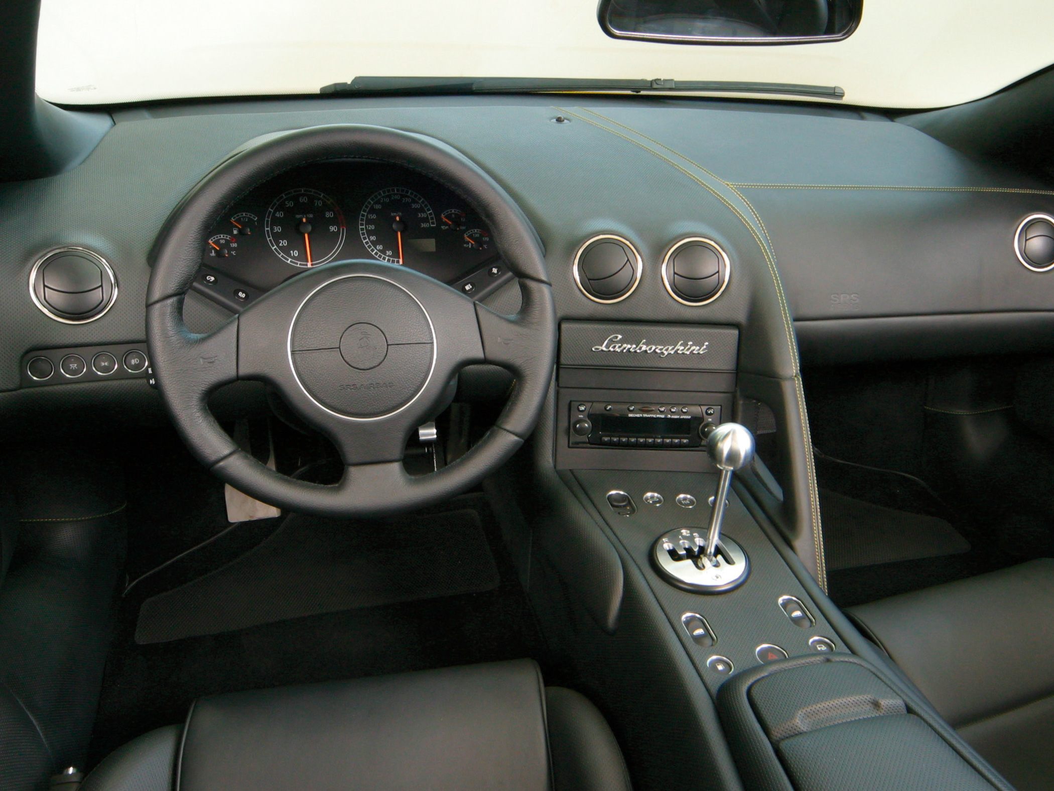 Interior featuring manual gated shifter and Lamborghini dashboard