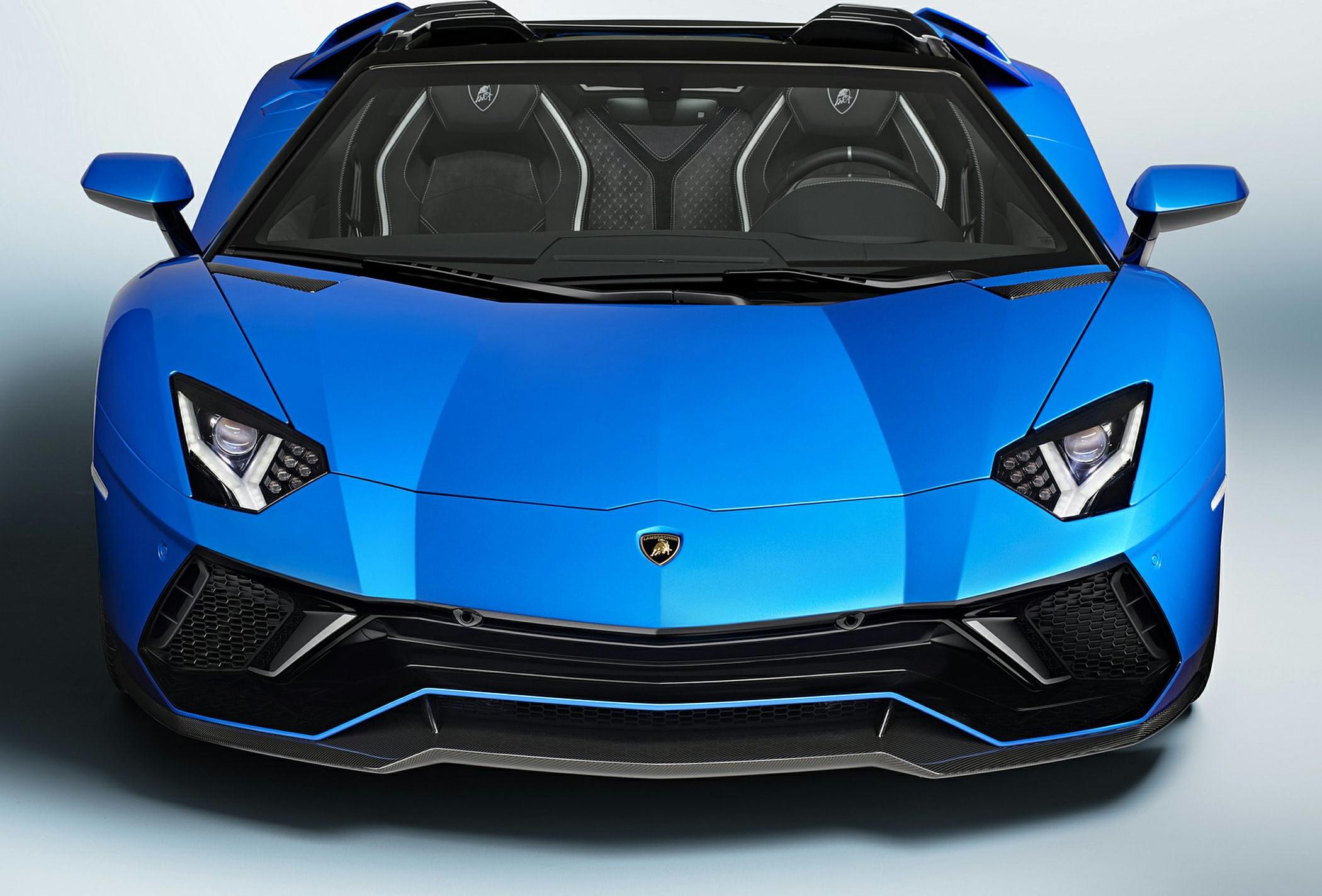 Aggressive front with angular headlights and aerodynamic front splitter.