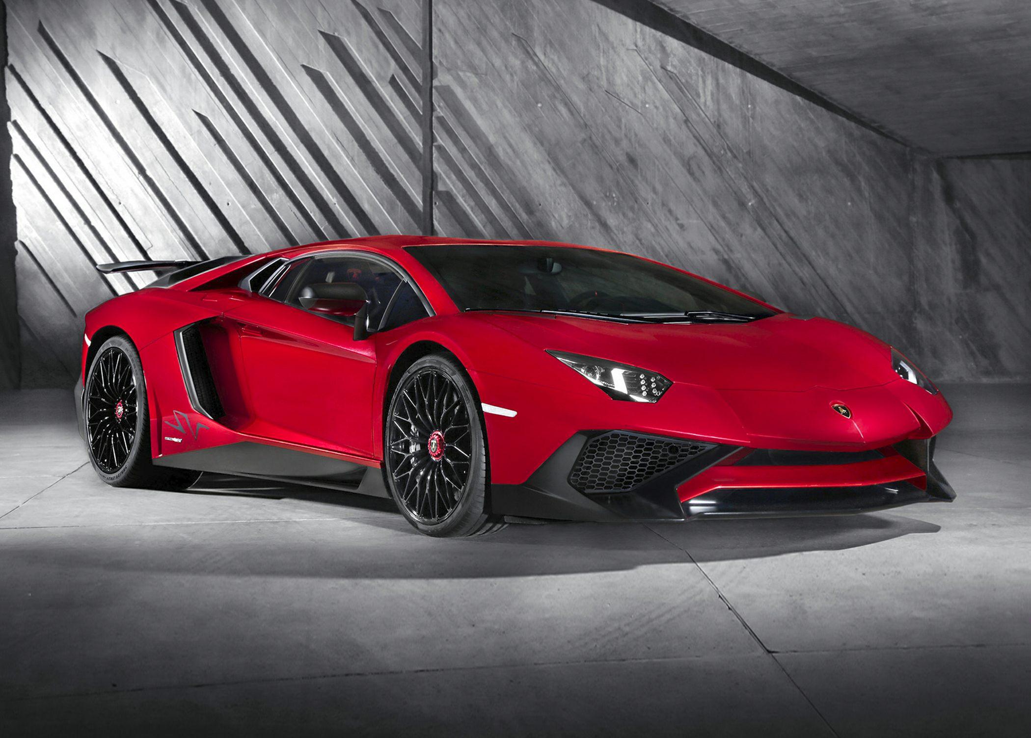 Aggressive front fascia and black multi-spoke wheels from front side view