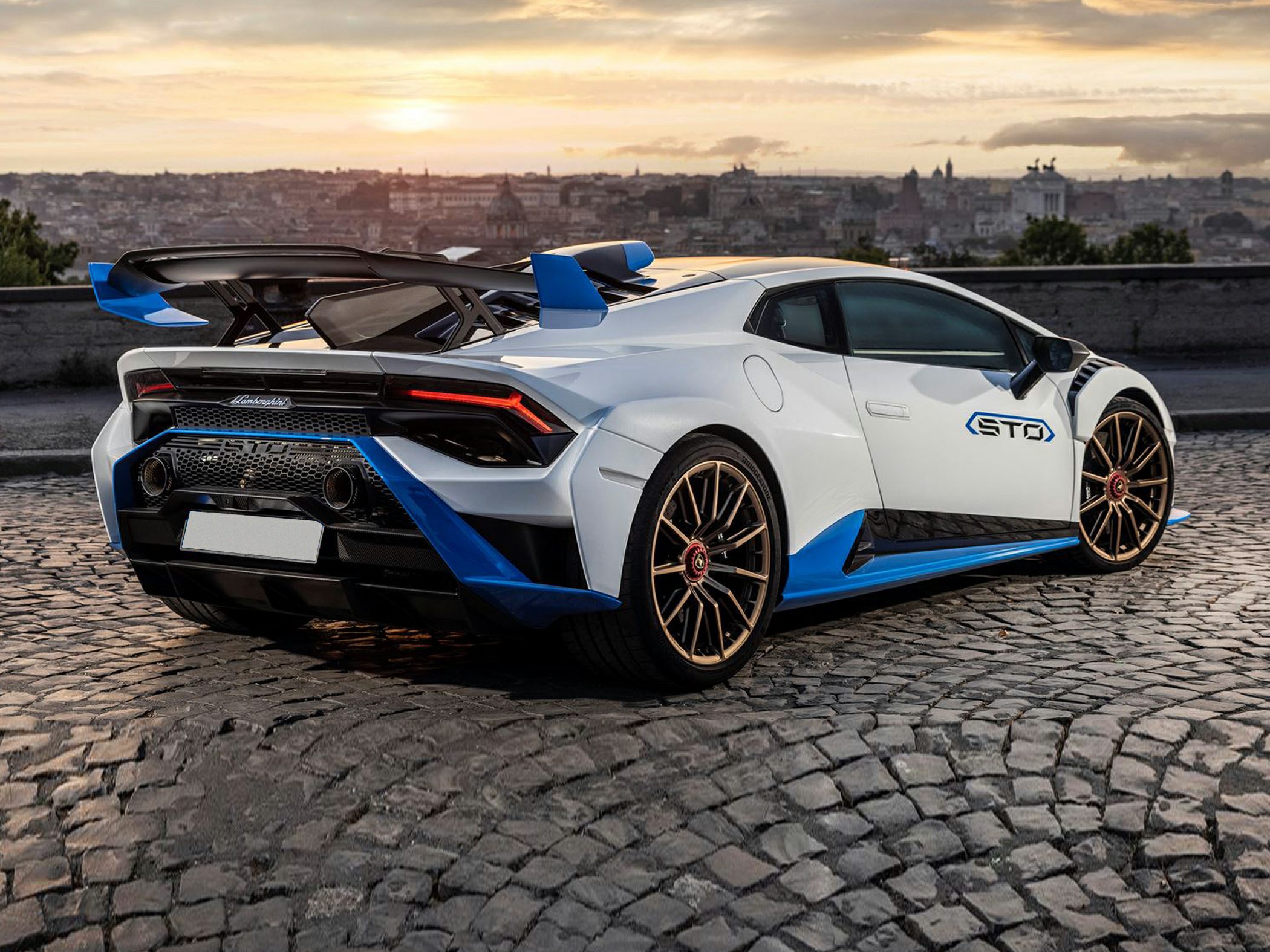 Rear wing and aerodynamic enhancements on a sports coupe