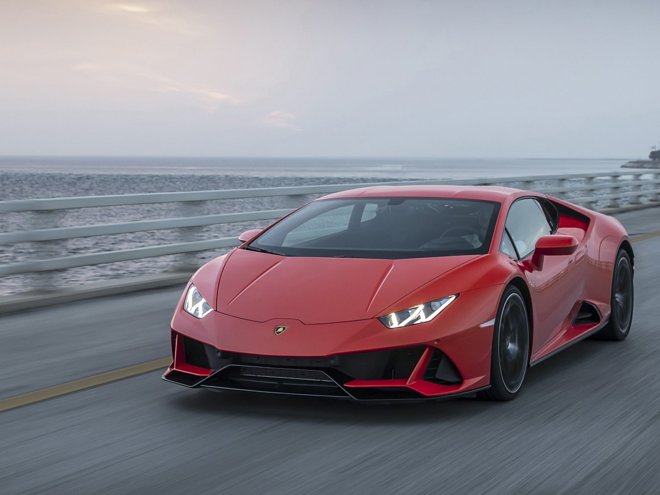 Dynamic front view of red sports car with LED headlights