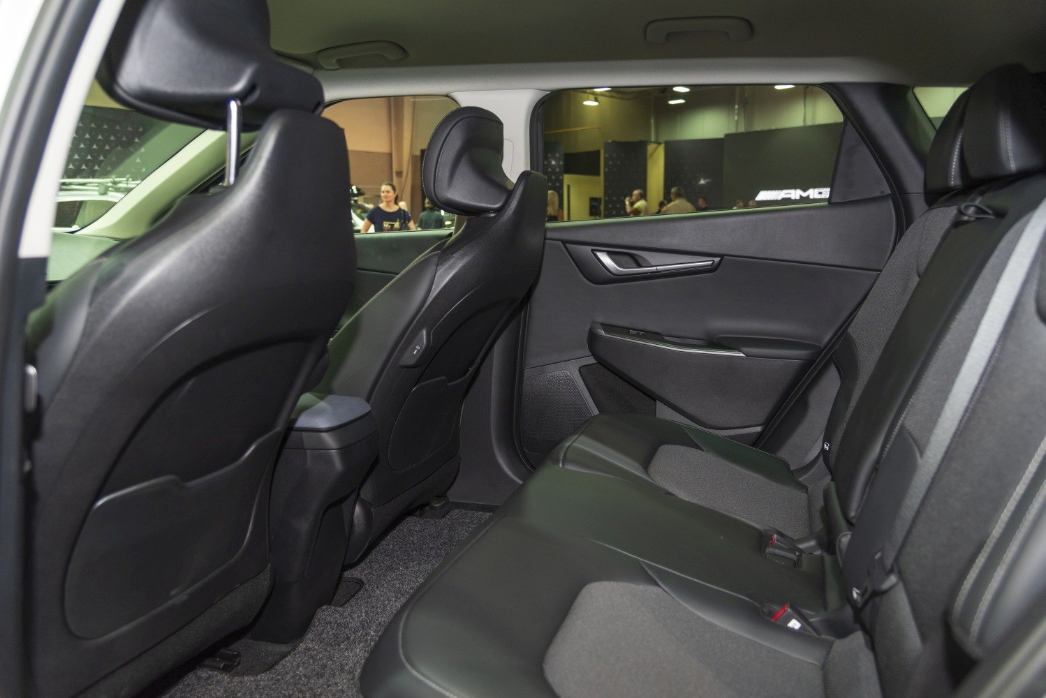 Rear passenger seating and interior door panel