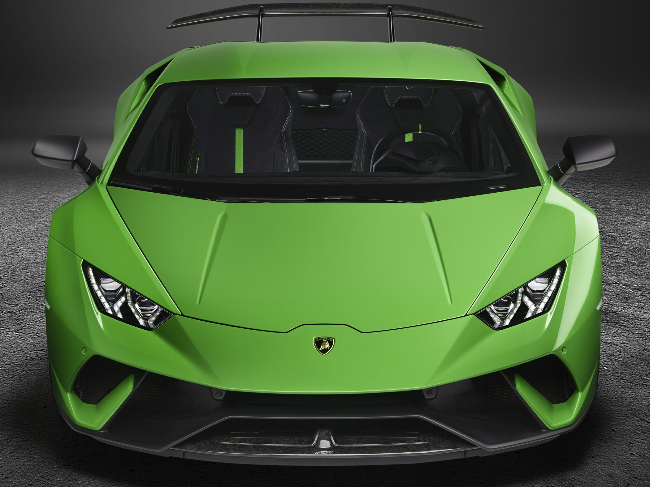 Front view with sharp LED headlights and rear aerodynamic wing