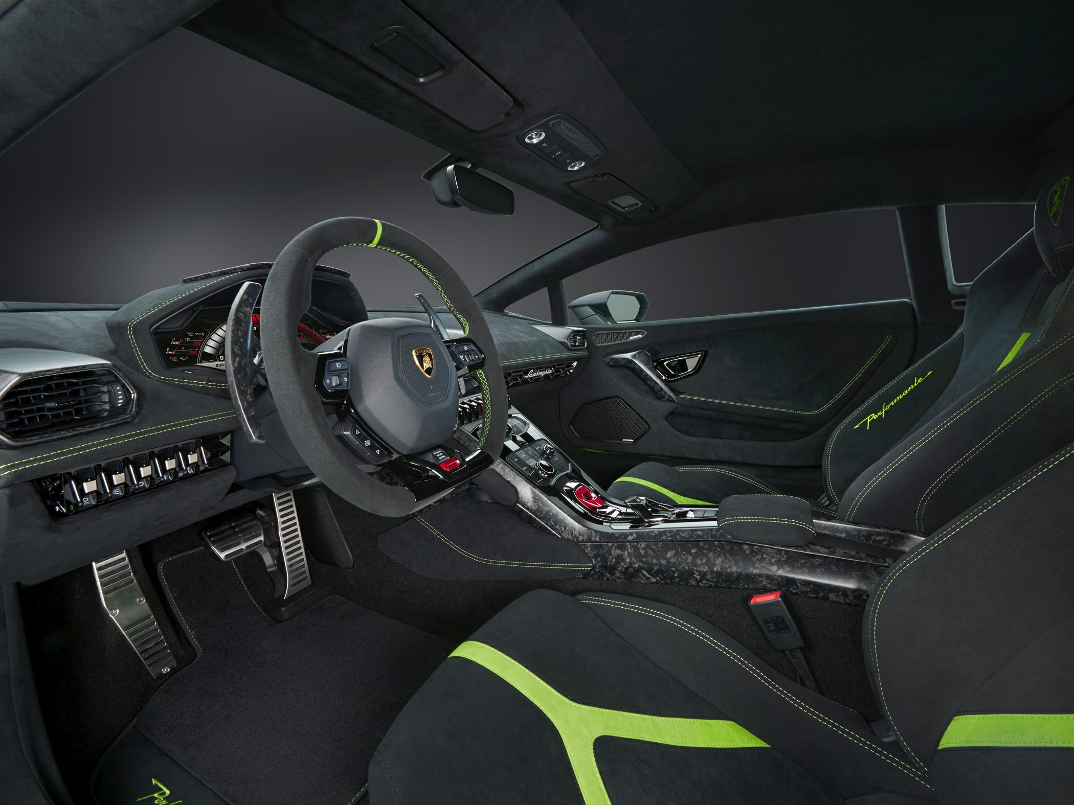 Alcantara interior with green stitching and carbon fiber accents