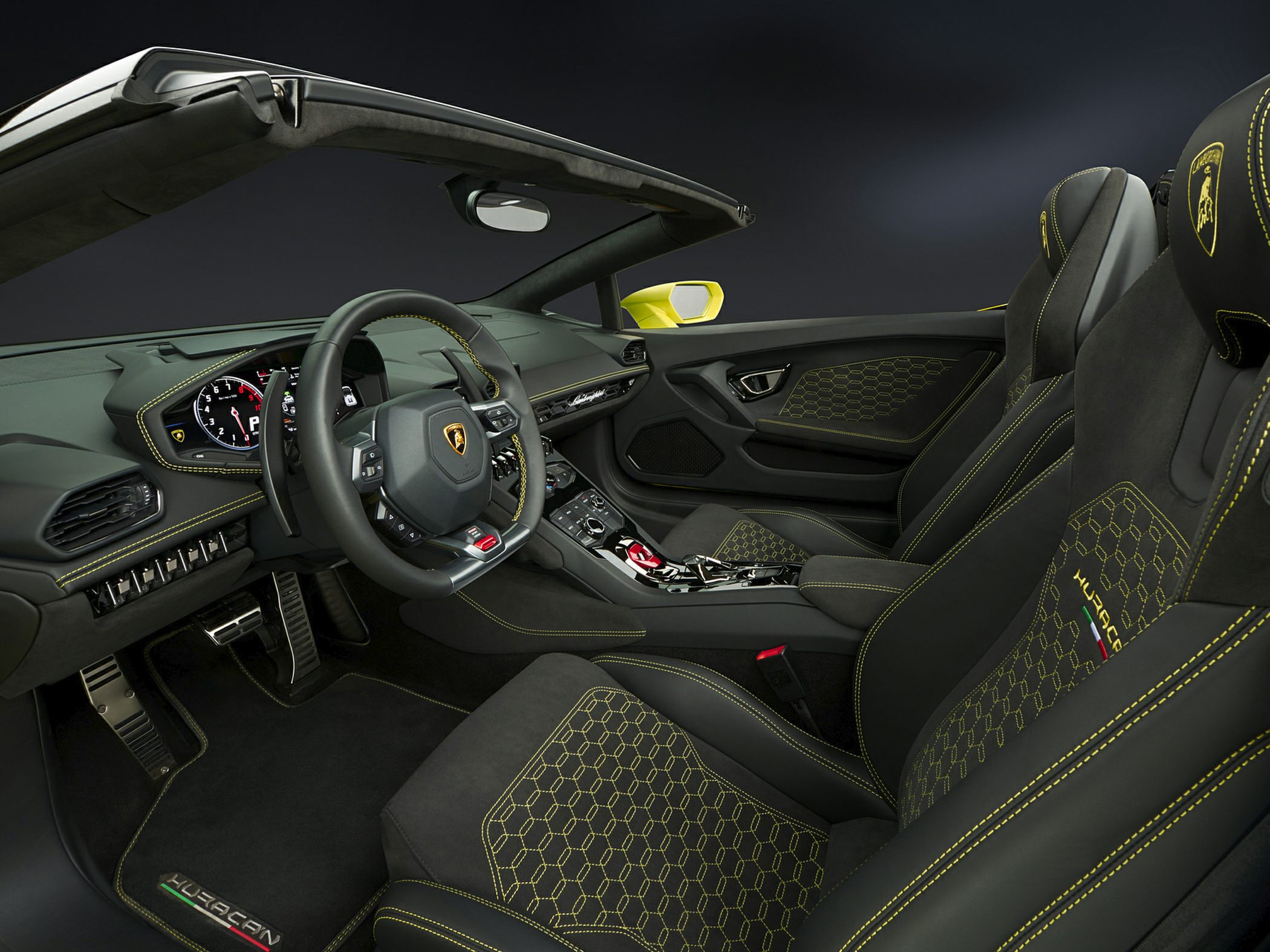 Convertible sports car interior with hexagonal stitching and advanced controls