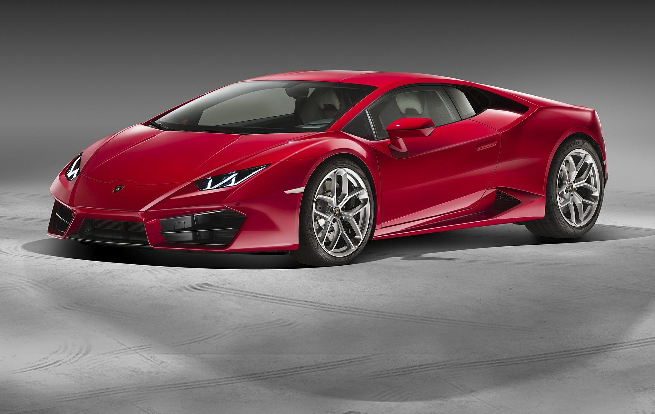 Sleek red sports car with sharp LED headlights and aggressive front design.