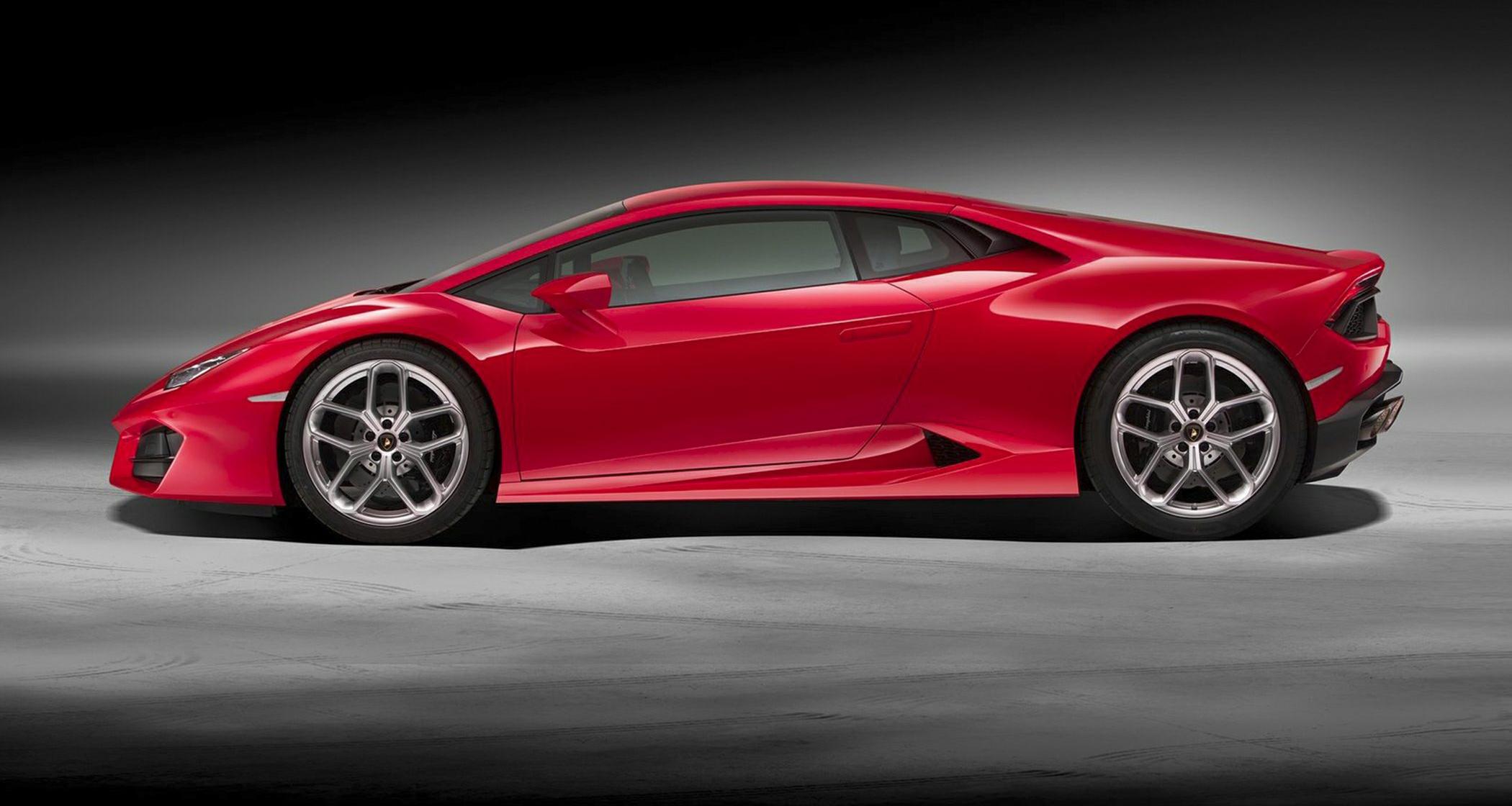 Aerodynamic red sports coupe with racing alloy wheels and low stance
