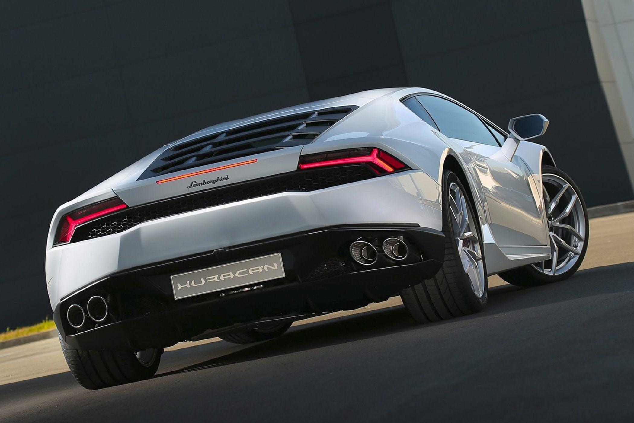 Rear view of sports coupe with quad exhausts and LED taillights