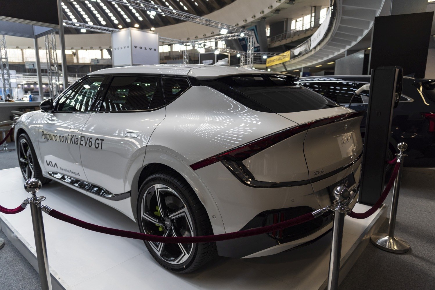Rear side view of an electric SUV with sleek tail light bar and aerodynamic shape