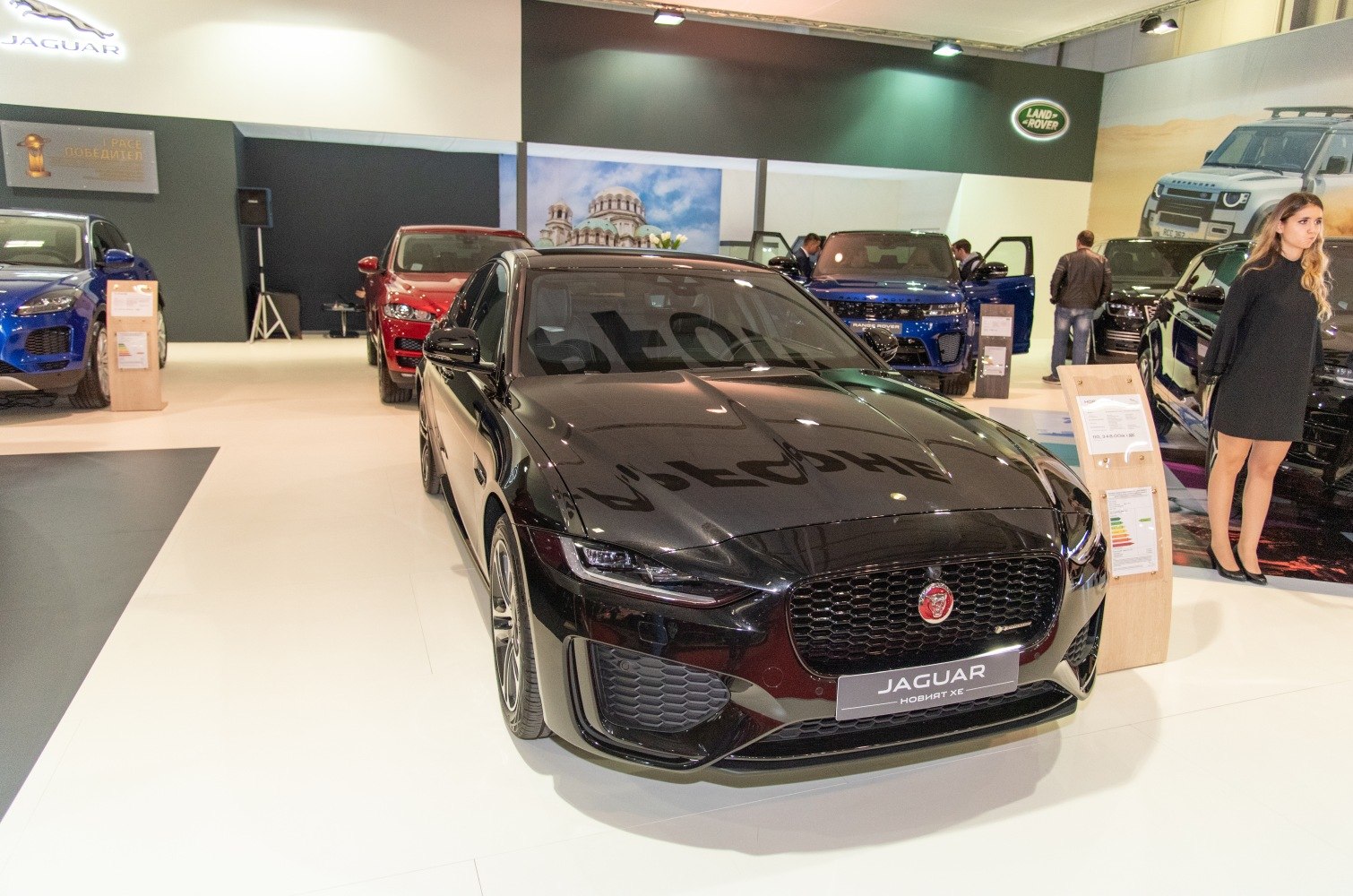 Sleek front grille and LED headlights of black Jaguar XE facelift.