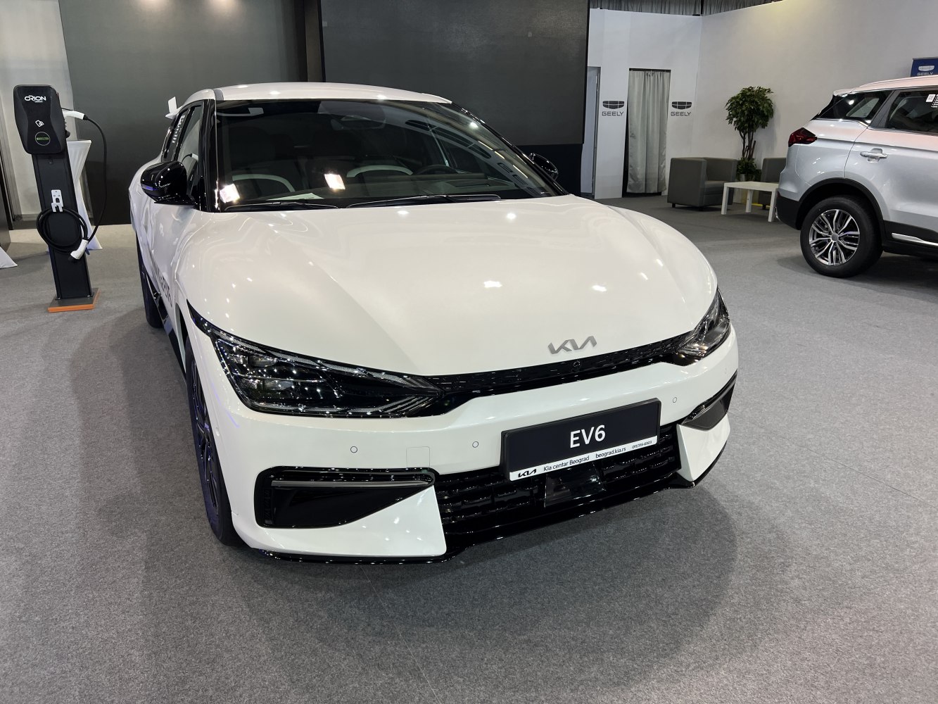 Front view of electric SUV with sleek headlights and aerodynamic design